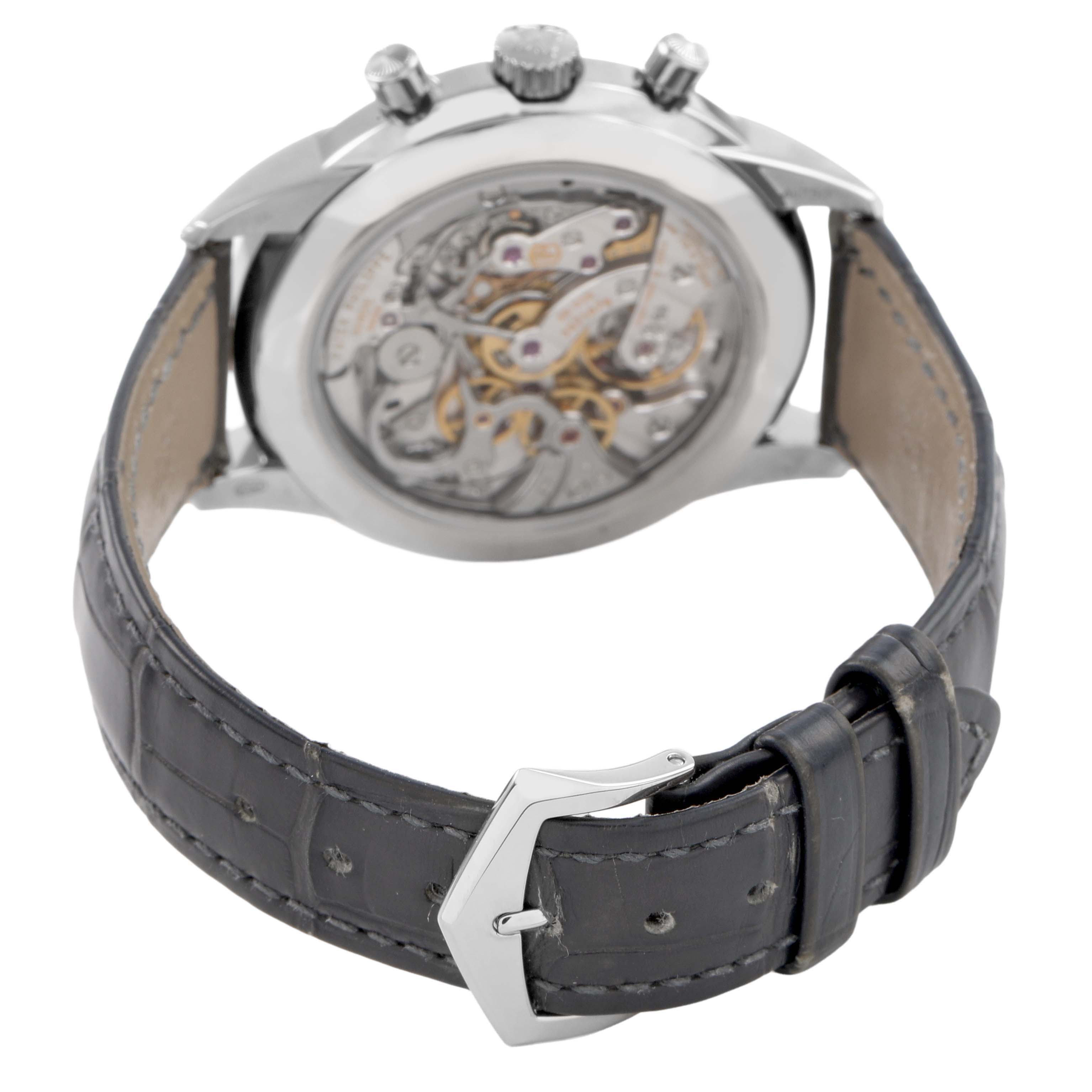 The image shows the back view of a Patek Philippe Complications 5172G-001 Men's White Gold Orange Dial model, highlighting the movement and leather strap with buckle.