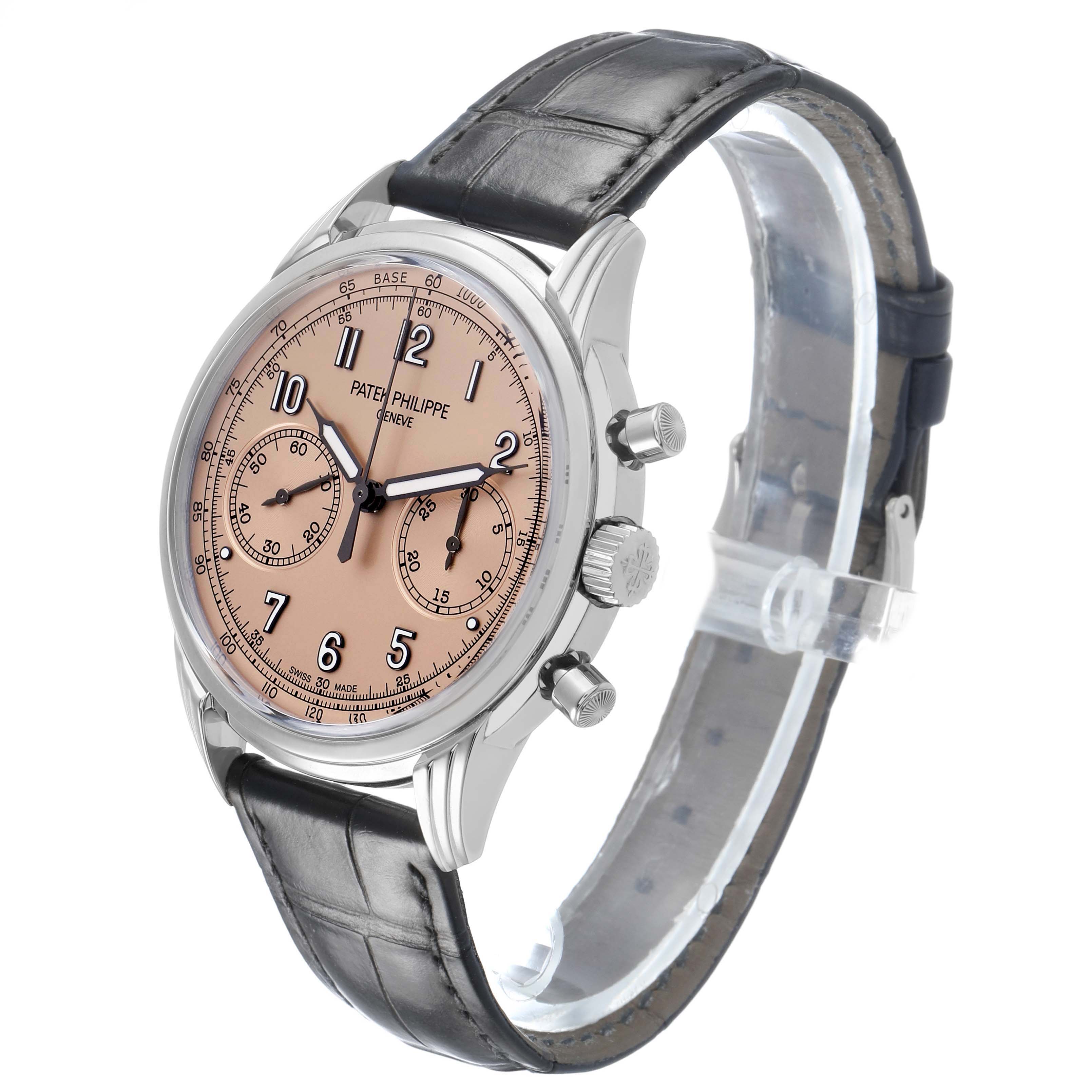 The Patek Philippe Complications 5172G-001 Men's White Gold Orange Dial watch is shown at a three-quarter angle, highlighting the face, side buttons, and leather strap.