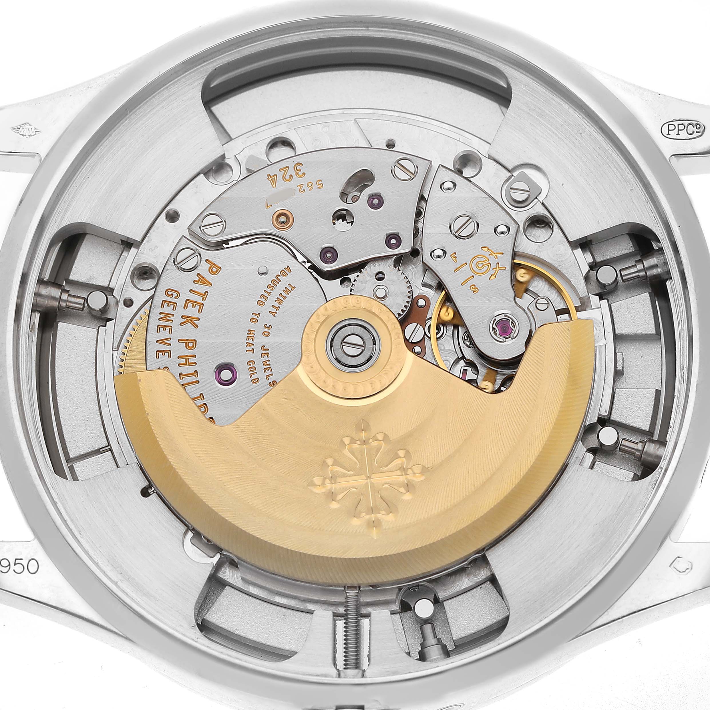 The image shows the movement of a Patek Philippe Complications 5496P Men's Platinum Silver Dial watch from a top-down angle, highlighting its intricate mechanics.