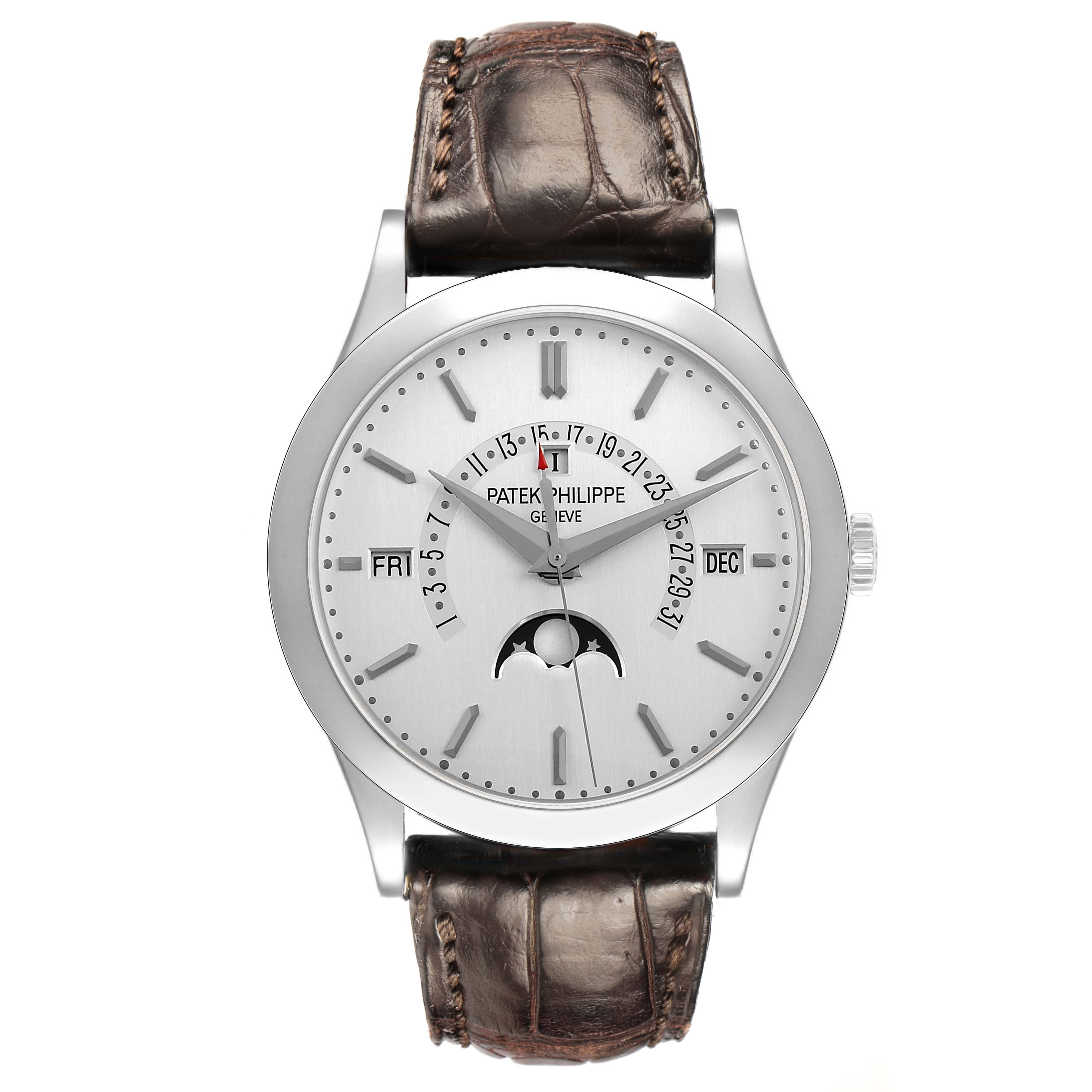 The Patek Philippe Complications 5496P Men's Platinum Silver Dial watch is shown from the front, displaying the dial, hands, and calendar functions with a leather strap.