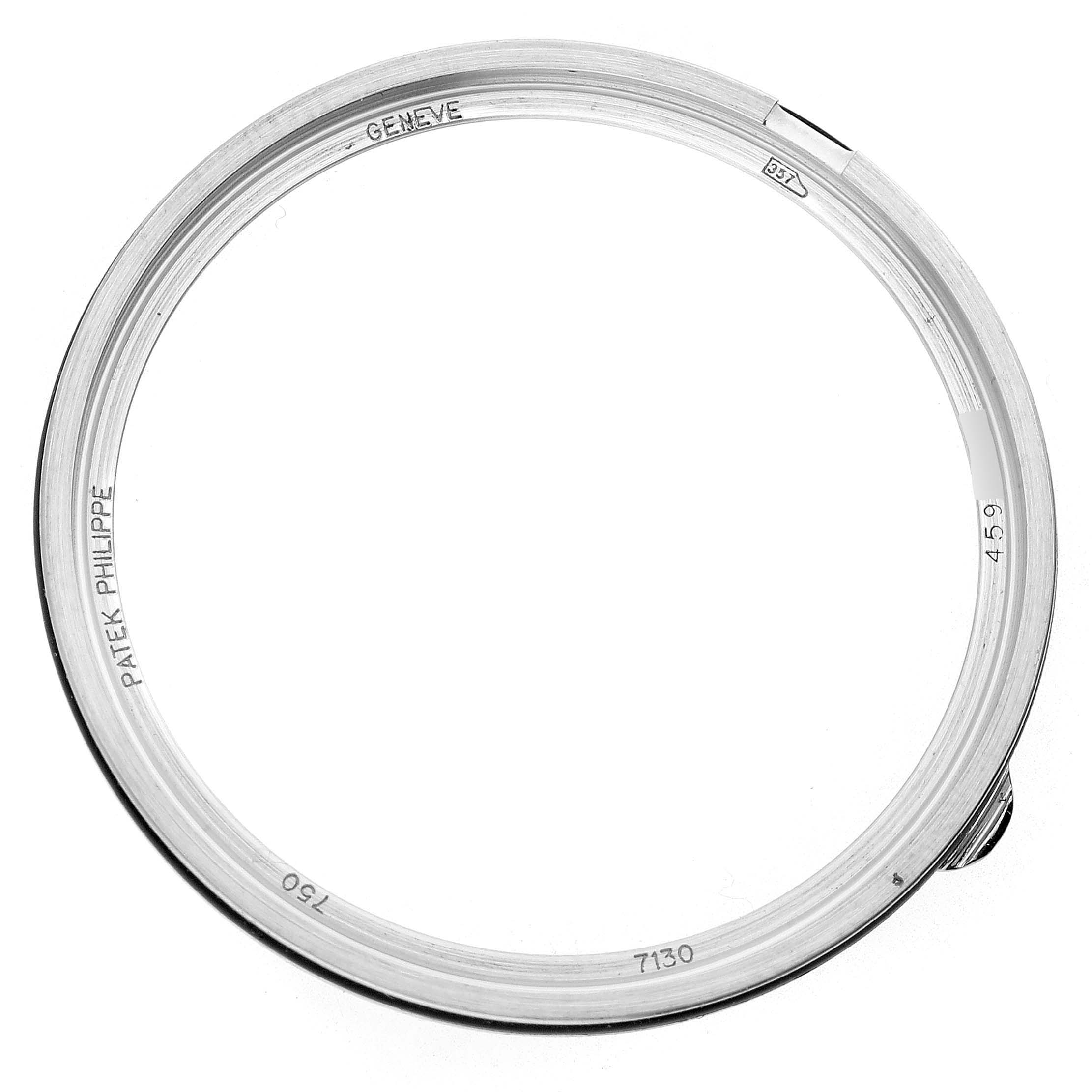 The image shows a top-down view of a bezel for the Patek Philippe Complications 7130G Men's White Gold Brown Dial model, displaying engraved details.