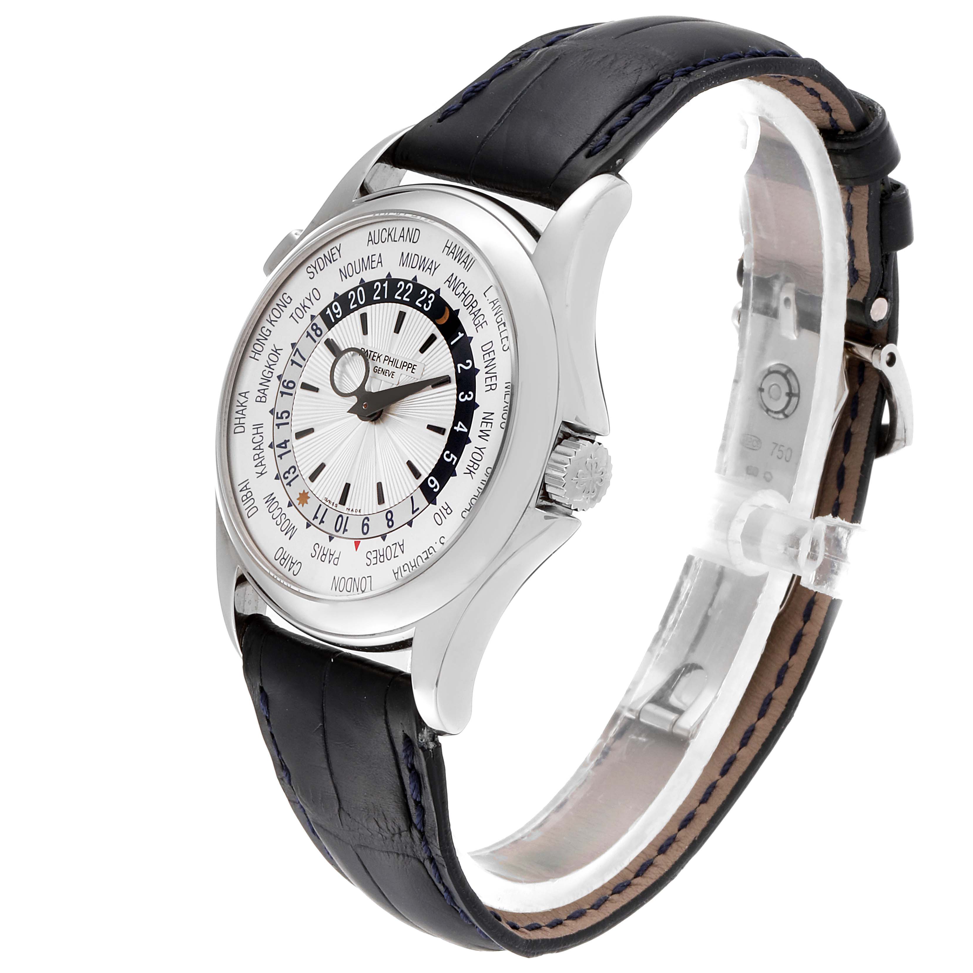 The Patek Philippe Complications 5130G Men's White Gold Silver Dial 5130G Men's White Gold Silver Dial watch is shown at an angle highlighting its face and side, with a black leather strap and world time dial.