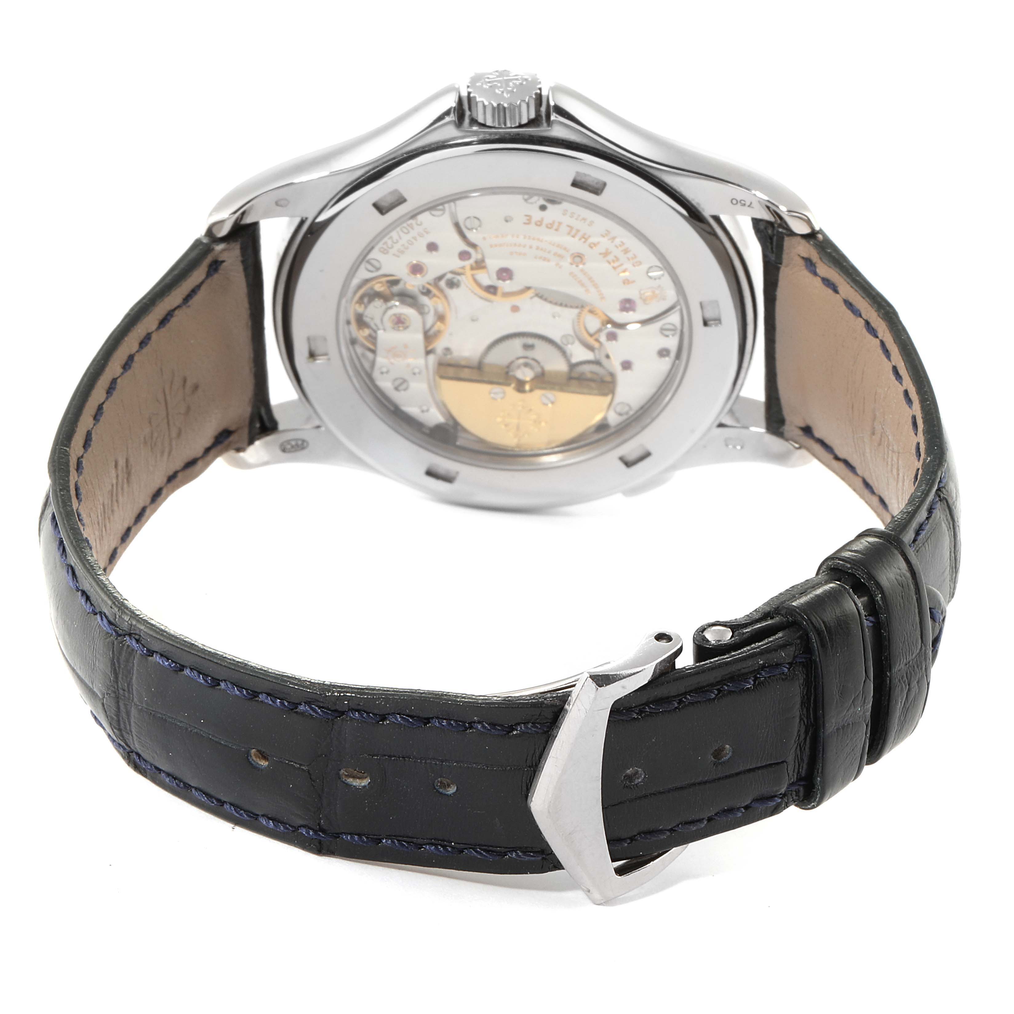The image shows the back of a Patek Philippe Complications 5130G Men's White Gold Silver Dial 5130G Men's White Gold Silver Dial watch, highlighting its movement, leather strap, and buckle.