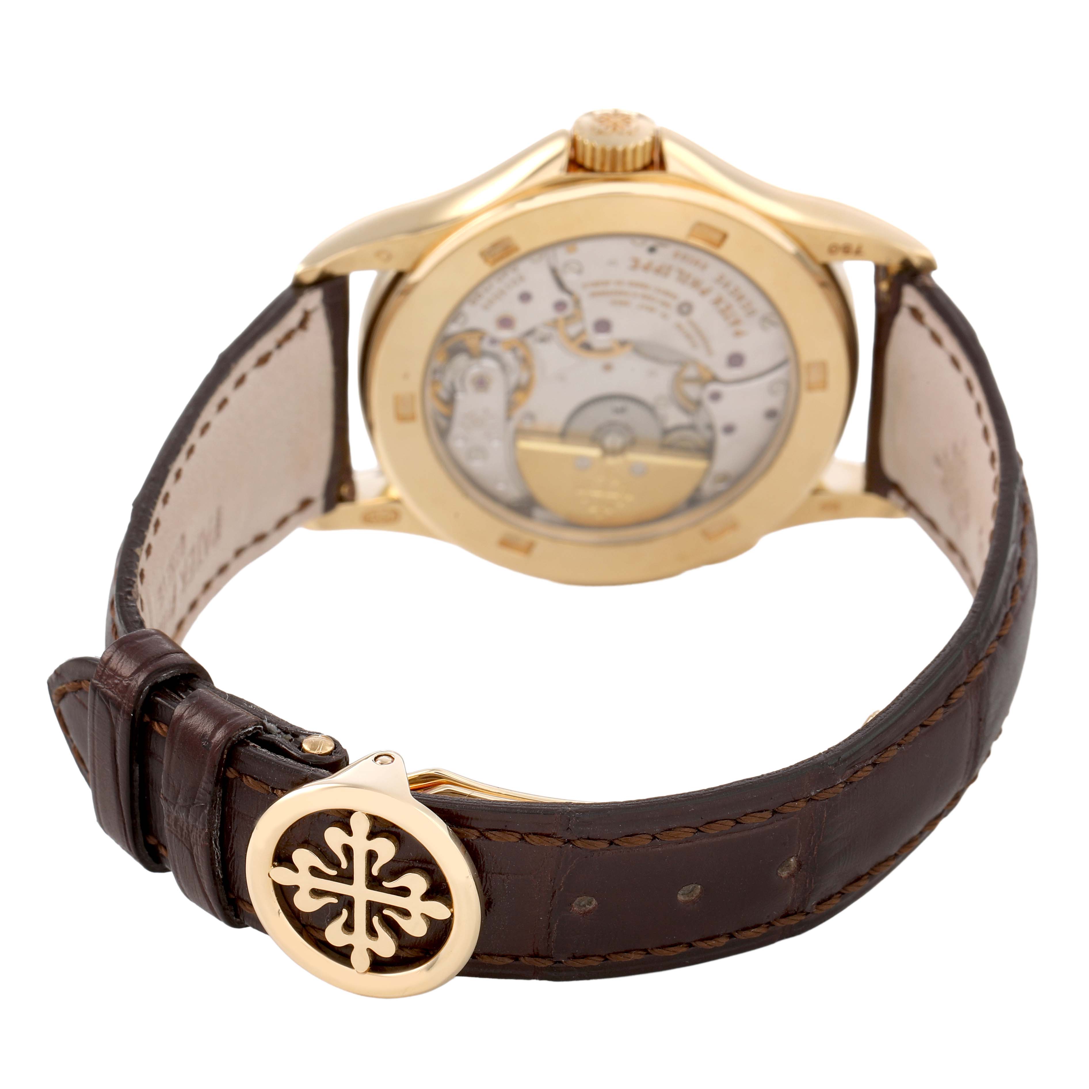 The Patek Philippe Complications 5110J Men's Yellow Gold Silver Dial watch is shown from the back, highlighting the movement and brown leather strap.