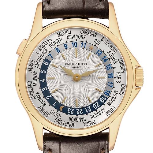 The Patek Philippe Complications 5110J Men's Yellow Gold Silver Dial watch is shown from the front, highlighting the dial with world time zones and gold hands.
