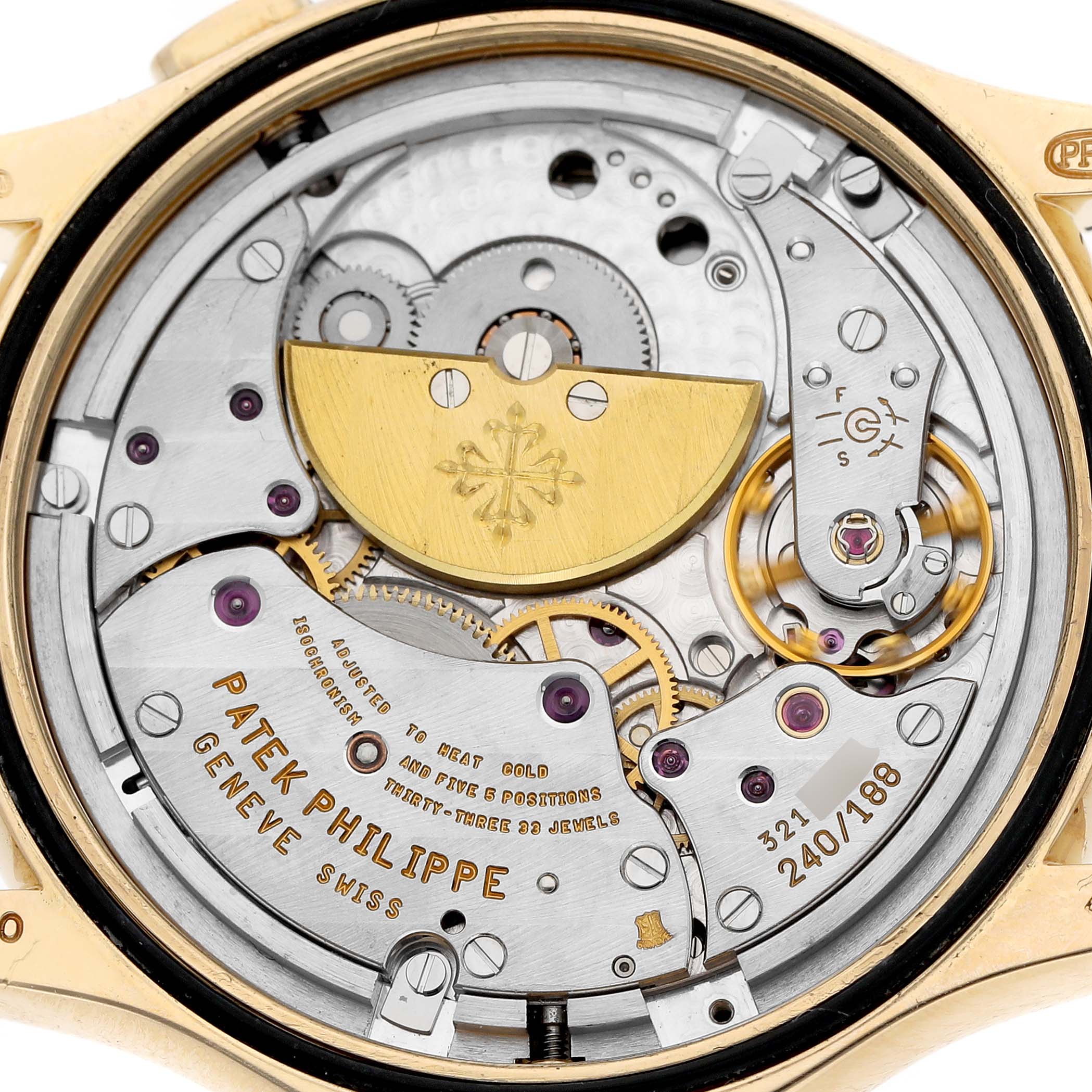 This image shows the intricate movement of a Patek Philippe Complications 5110J Men's Yellow Gold Silver Dial watch from a rear angle.