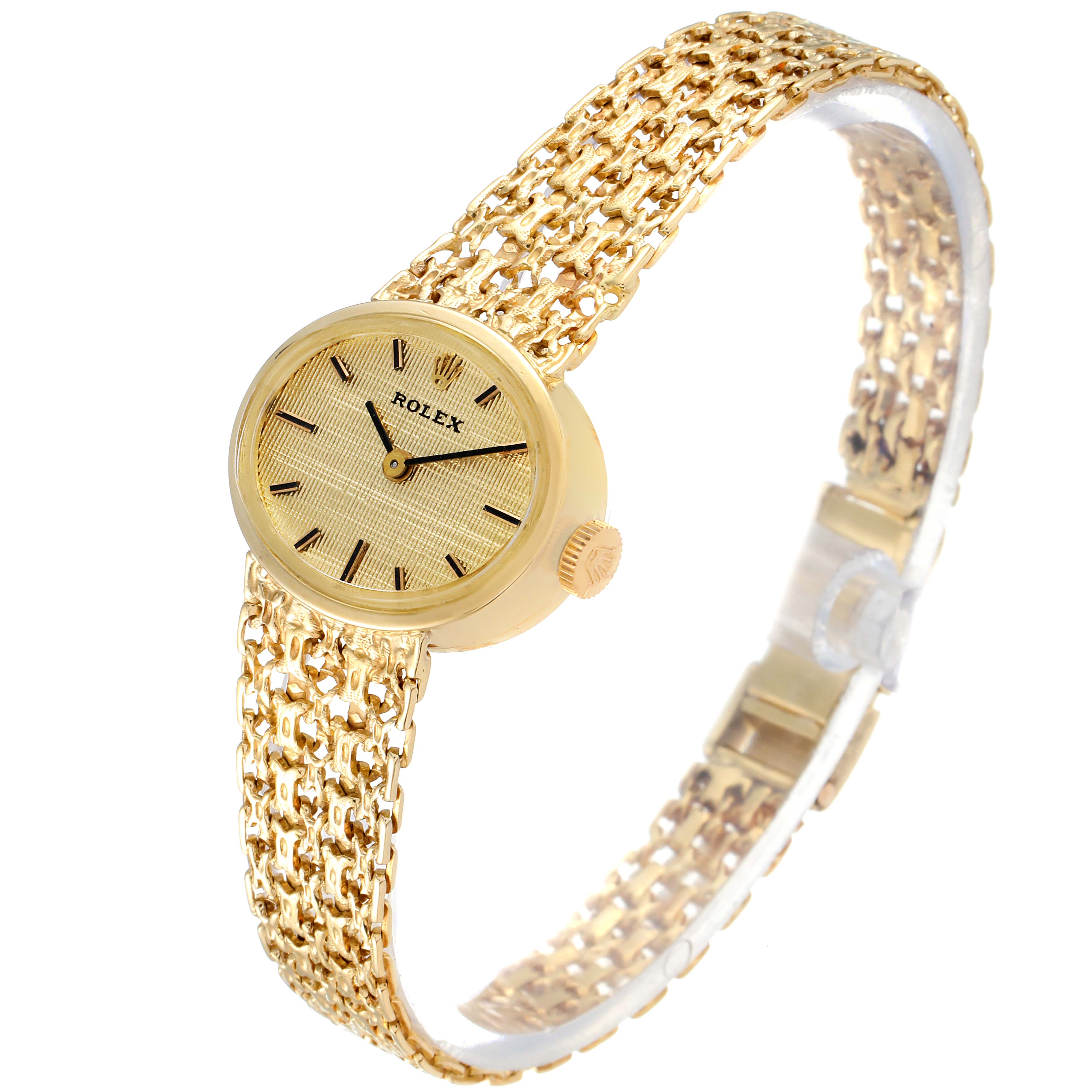 The image shows a Rolex Cocktail Women's Yellow Gold Champagne Dial Women's Yellow Gold Champagne Dial model watch from a diagonal angle, highlighting its gold case, dial, and intricate bracelet.