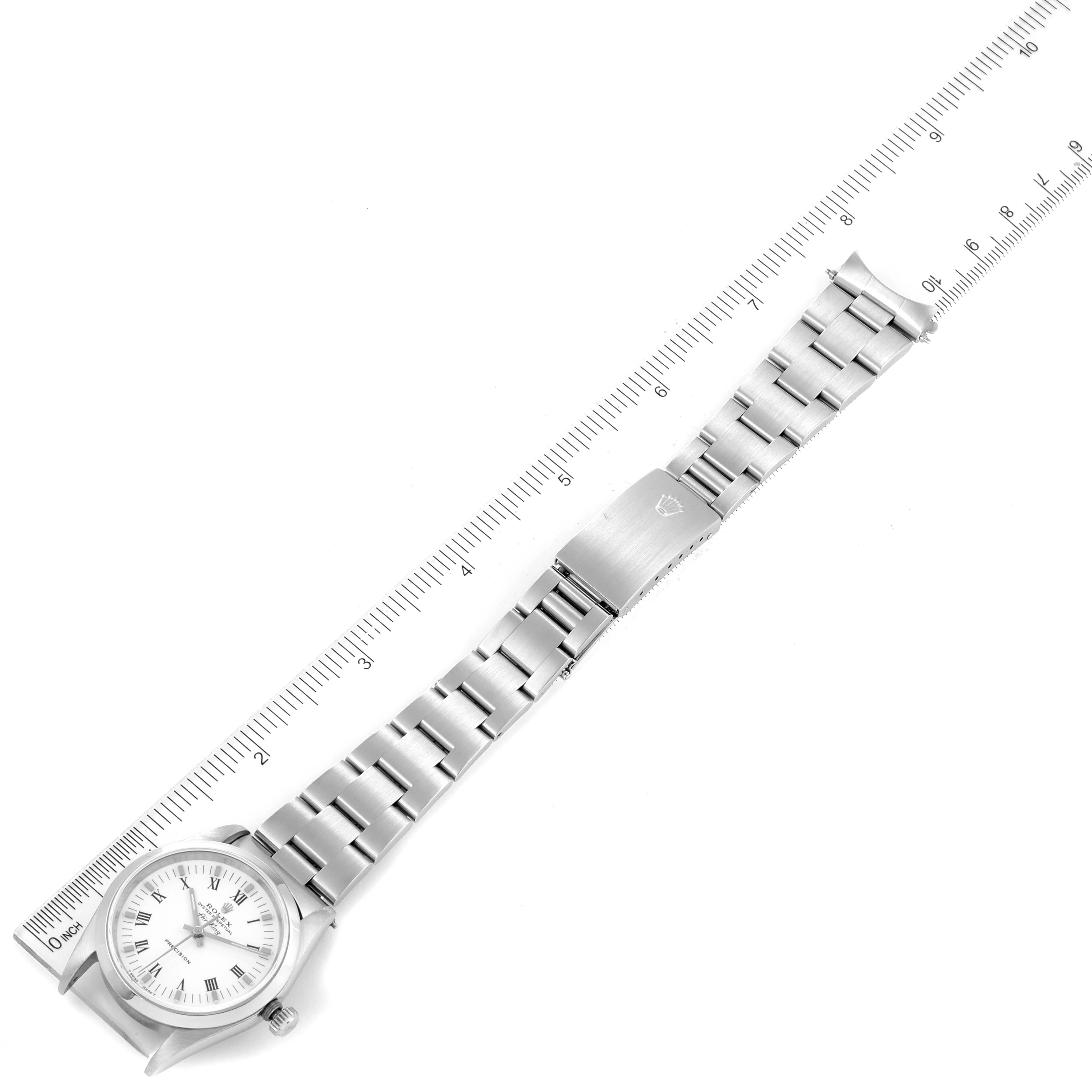 The image shows a Rolex Air-King 14000 Men's Stainless Steel White Dial 14000 Men's Stainless Steel White Dial watch laid flat, featuring its face, bracelet, and clasp, alongside a measuring scale for size reference.