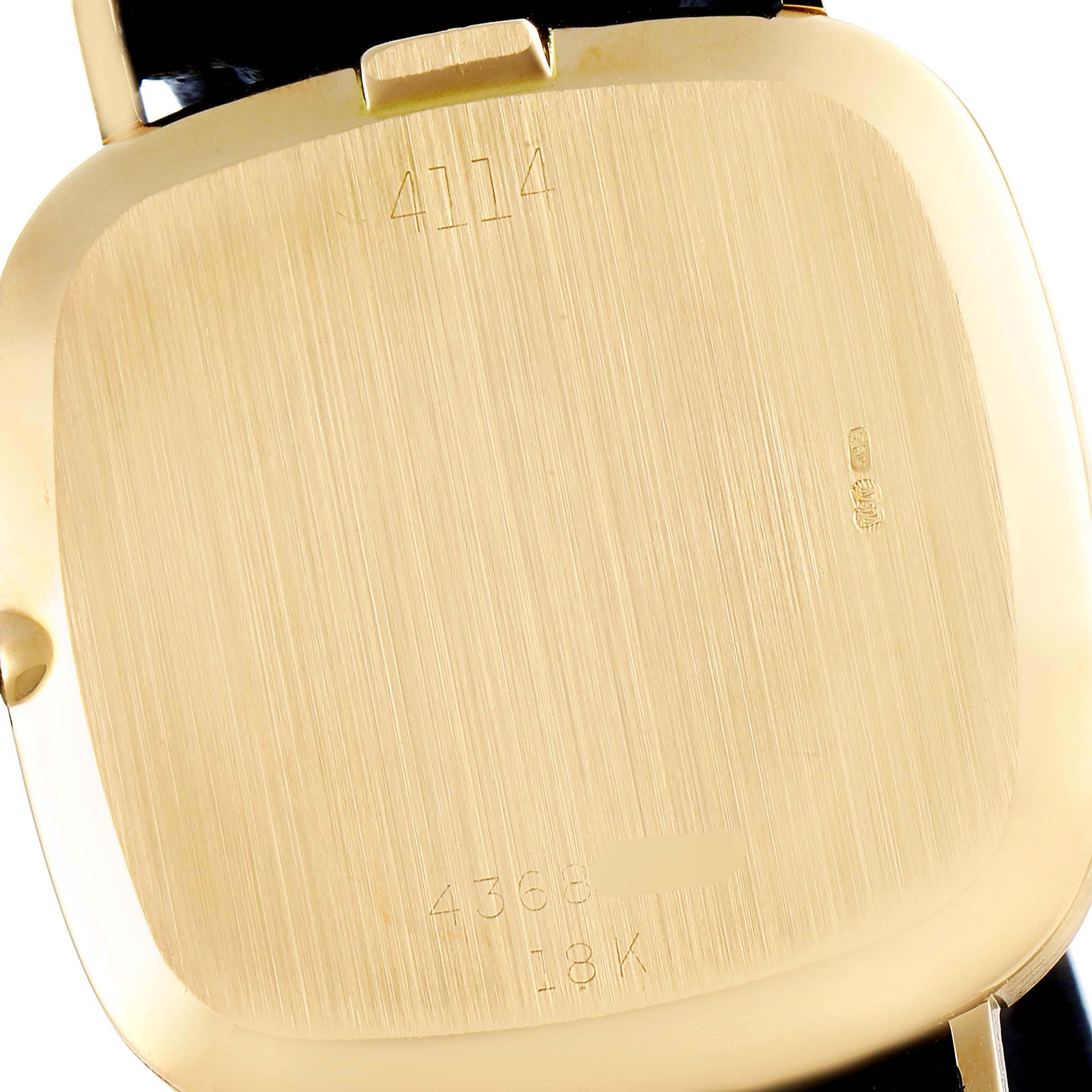 This image shows the back of the Vintage Collection model by Rolex, highlighting its gold case and engraved details.