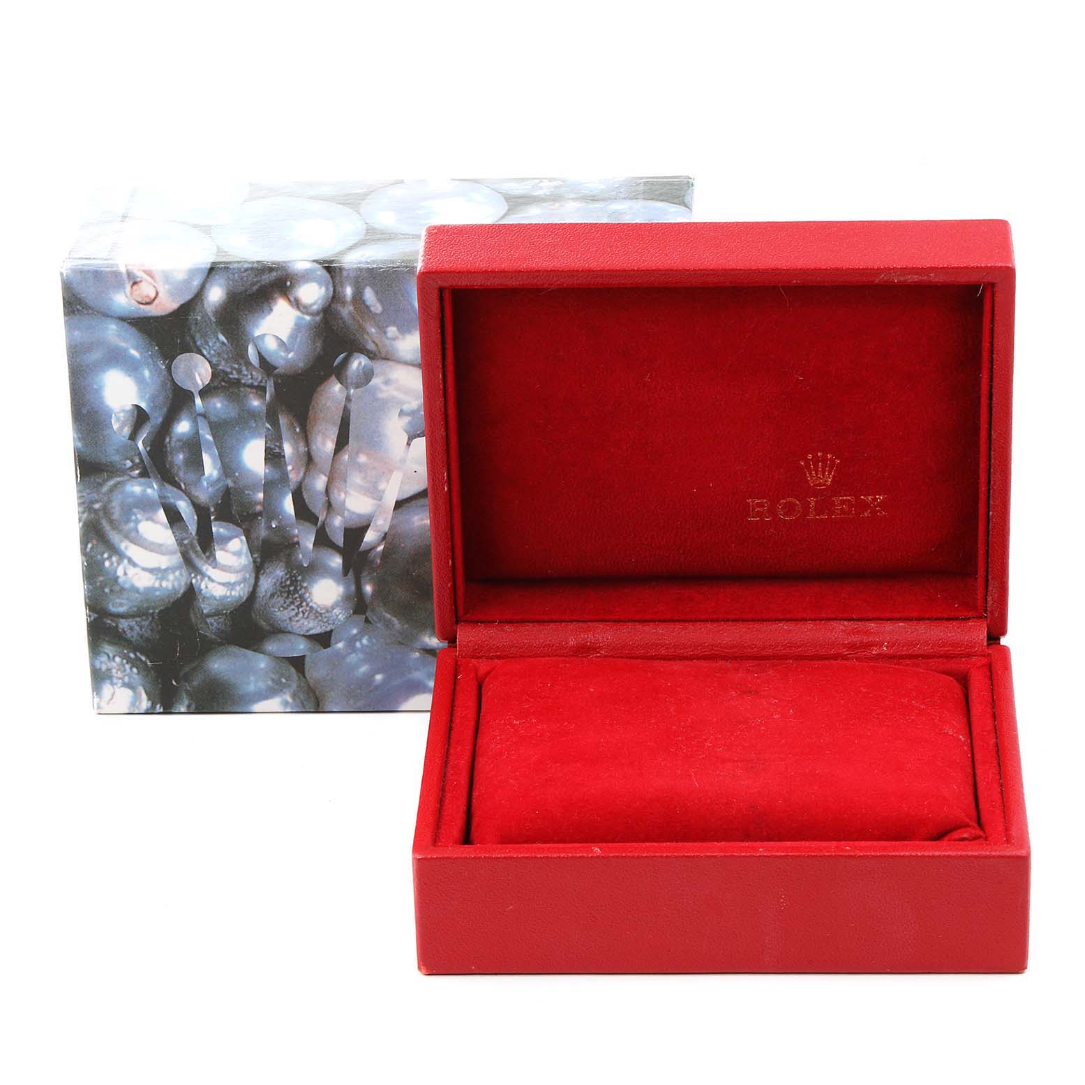 The image shows an empty red Rolex box for the Date model, along with an outer box featuring the Rolex emblem.