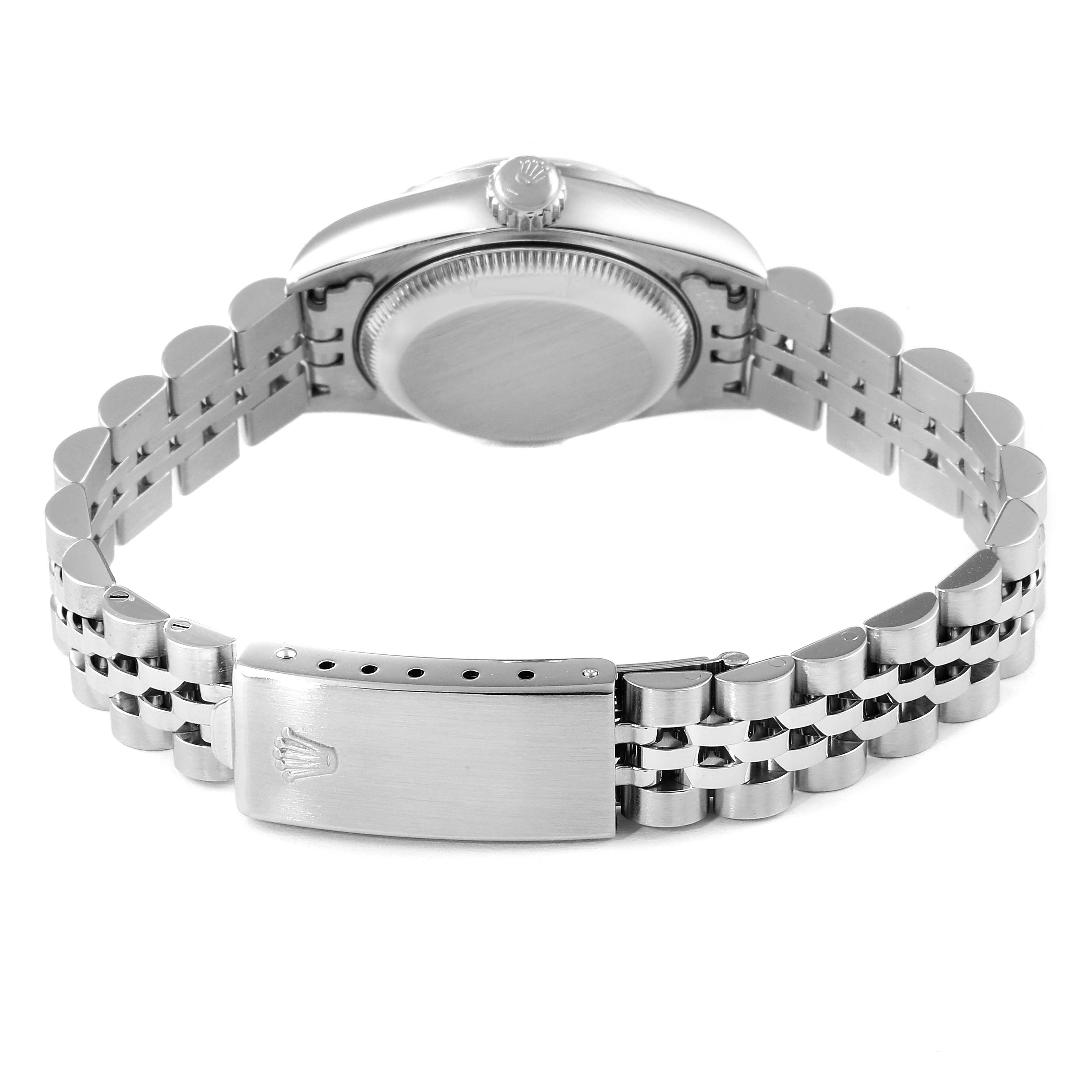 The image shows the back view of a Rolex Date 69240 Women
s Stainless Steel Black Dial 69240 Women
s Stainless Steel Black Dial model watch, highlighting the case back, crown, and bracelet clasp.