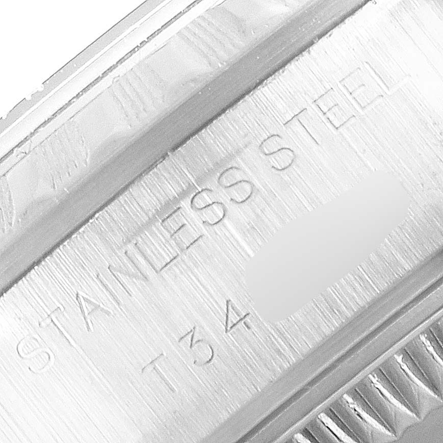 The image shows a close-up of the inner bezel of a Rolex Date 69240 Women
s Stainless Steel Black Dial 69240 Women
s Stainless Steel Black Dial watch, highlighting the stainless steel marking.