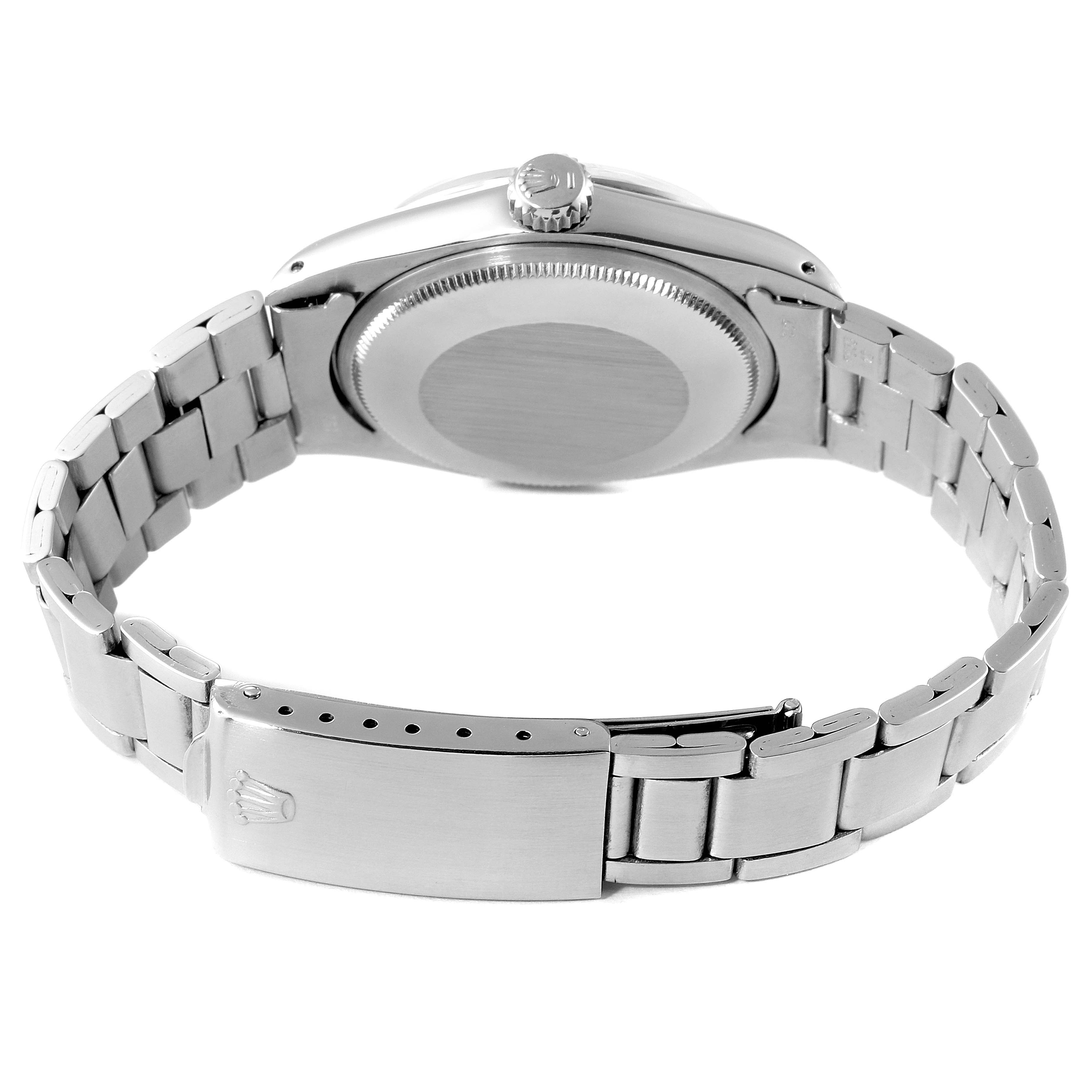 This Rolex Date 1500 Men's Stainless Steel Silver Dial 1500 Men's Stainless Steel Silver Dial model watch is shown from the back, displaying the case back, crown, and bracelet with the clasp.