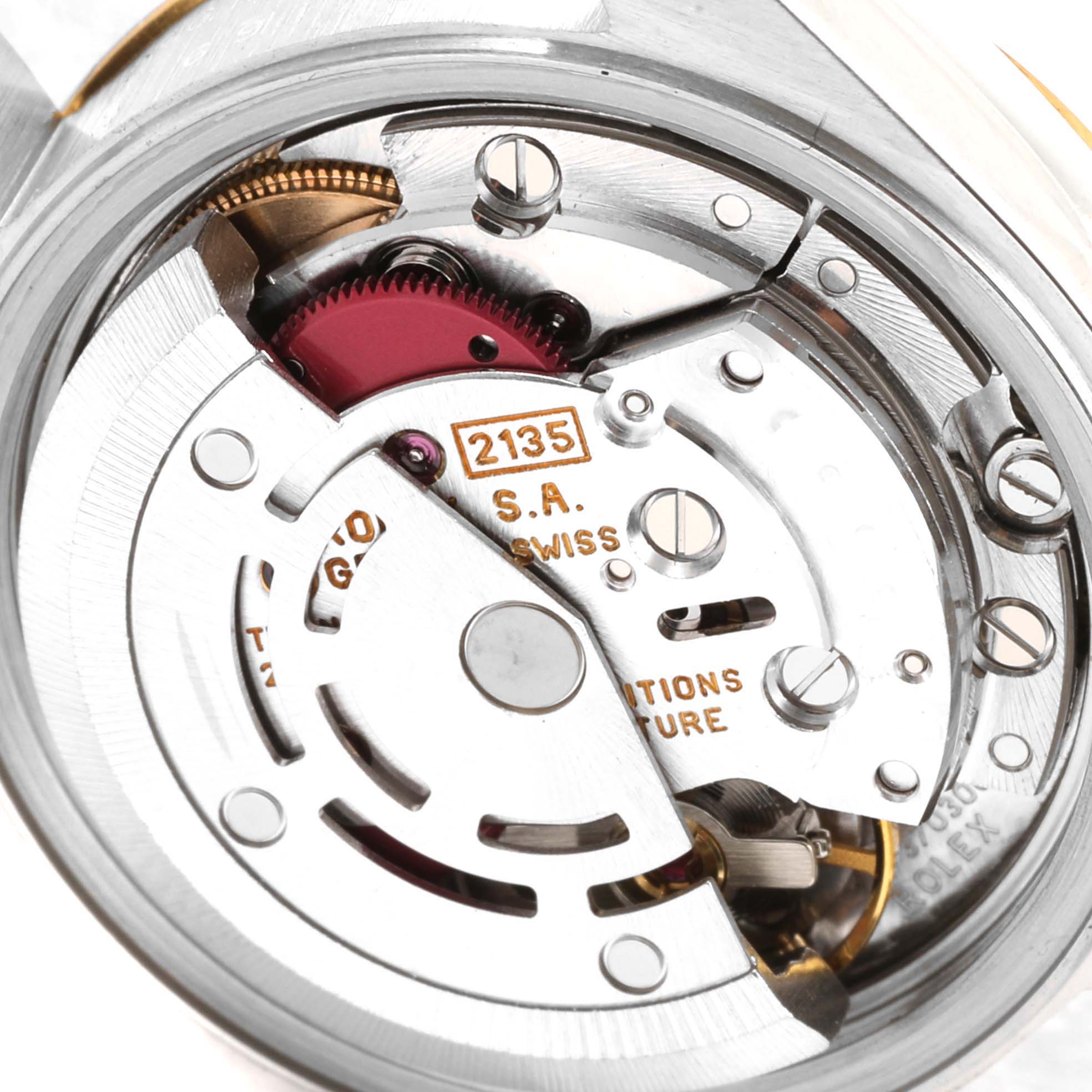 This image shows a close-up of the movement mechanism of a Rolex Datejust 69173 Women's Steel and Gold (two tone) Champagne Dial 69173 Women's Steel and Gold (two tone) Champagne Dial watch, highlighting its intricate internal components.