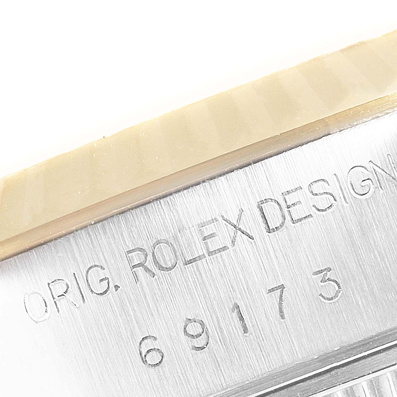 The image shows a close-up angle of the Rolex Datejust 69173 Women's Steel and Gold (two tone) Champagne Dial 69173 Women's Steel and Gold (two tone) Champagne Dial case side, highlighting the model engraving "69173".