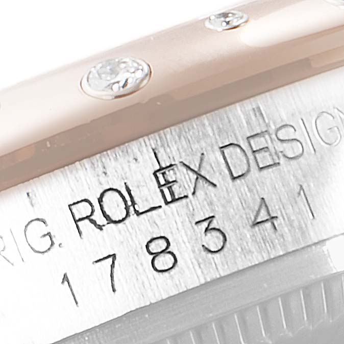 This image shows a close-up of a Rolex Mid-Size 178341 Women's Steel and Gold (two tone) Brown Dial 178341 Women's Steel and Gold (two tone) Brown Dial watch, highlighting the model number and part of the bezel with diamonds.