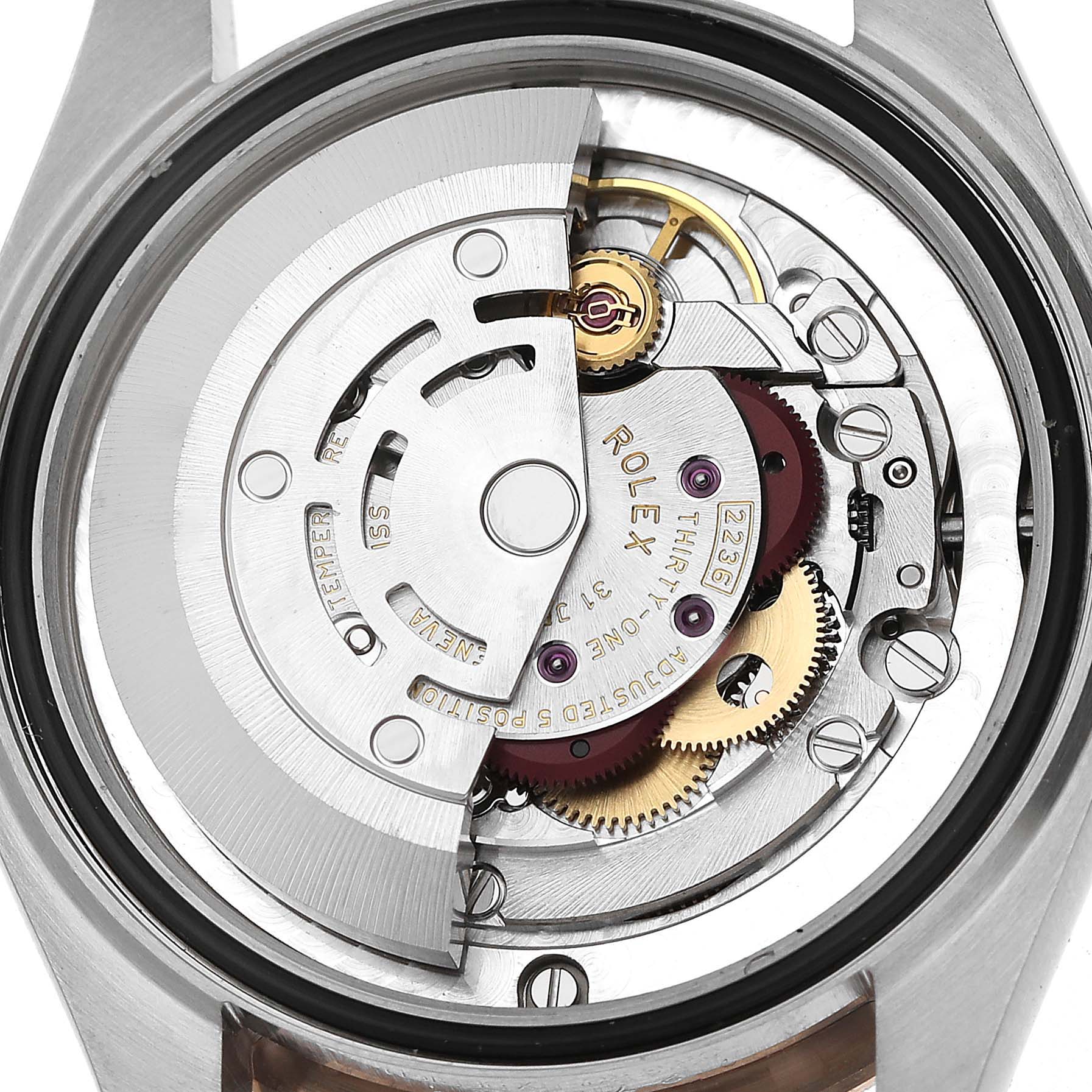 The image shows the movement and rotor of a Rolex Mid-Size 278271 Women's Steel and Gold (two tone) Silver Dial model from the back, highlighting gears and components.