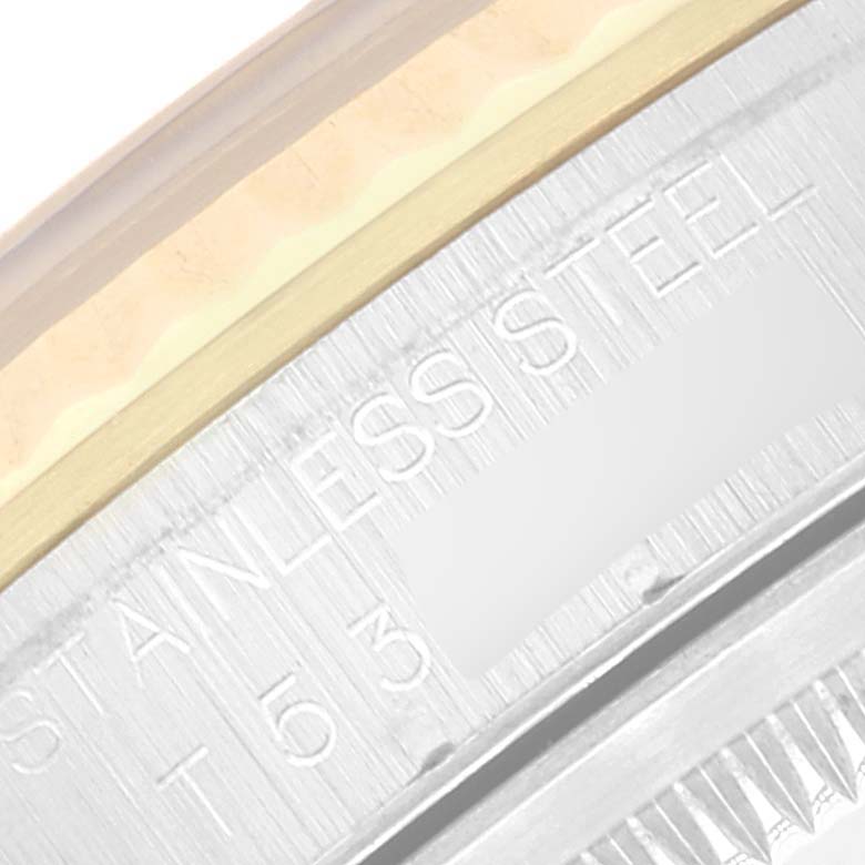 Close-up of the Rolex Datejust 16233 Men's Steel and Gold (two tone) Blue Dial 16233 Men's Steel and Gold (two tone) Blue Dial watch, focusing on the stainless steel and gold bezel with engraved text.