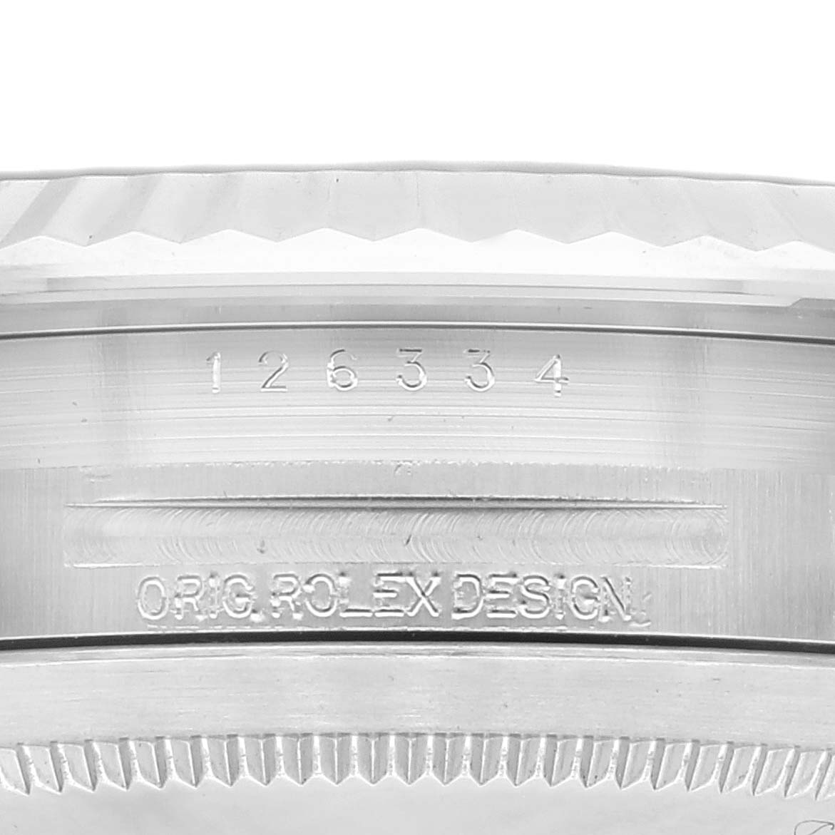 The image shows a close-up of the serial number and "ORIG. ROLEX DESIGN" engraving on the side of the Rolex Datejust 41 126334 Men's Stainless Steel Blue Dial 126334 Men's Stainless Steel Blue Dial model.
