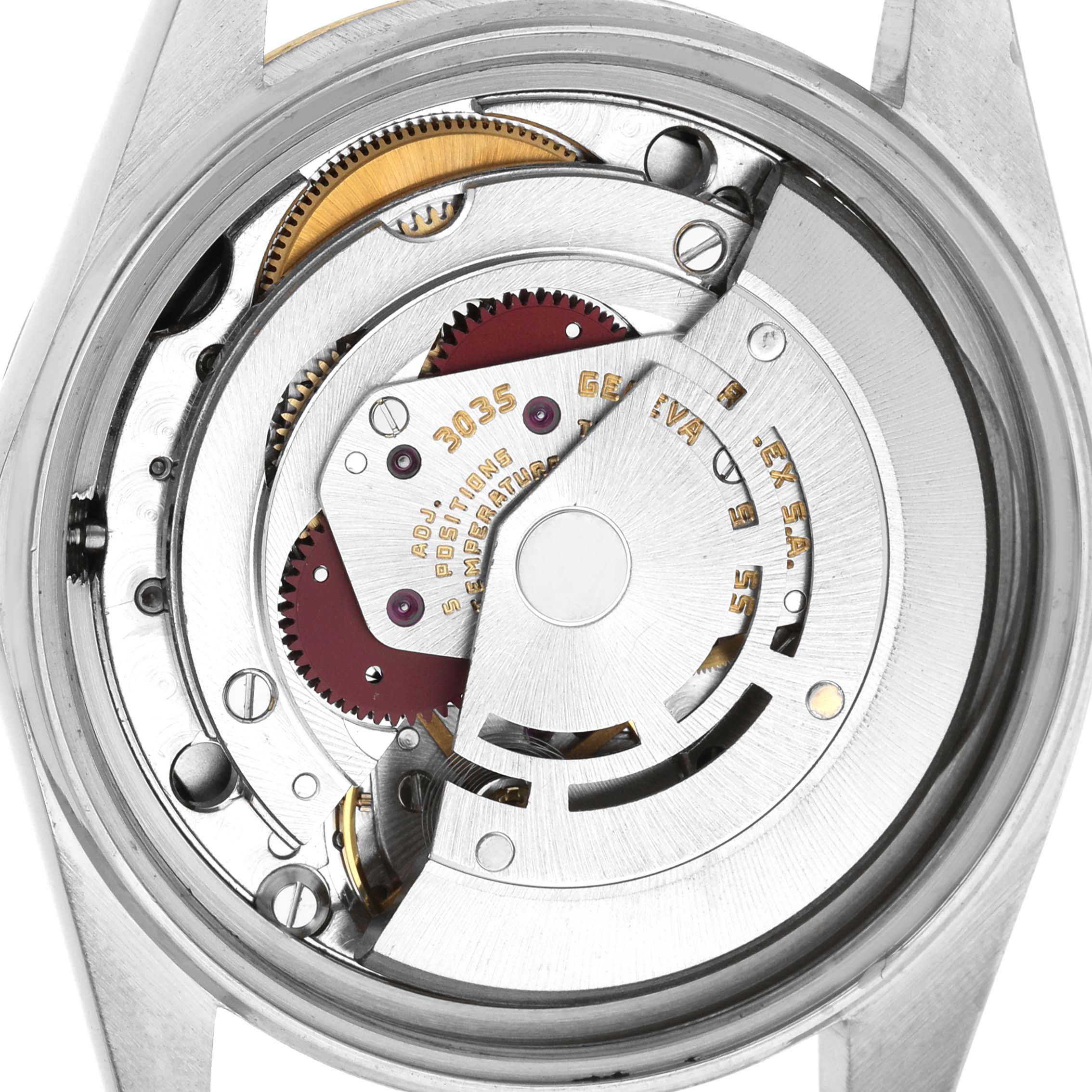 The image shows the back view of a Rolex Datejust 16013 Men's Steel and Gold (two tone) Black Dial, revealing its mechanical movement and rotor inside.
