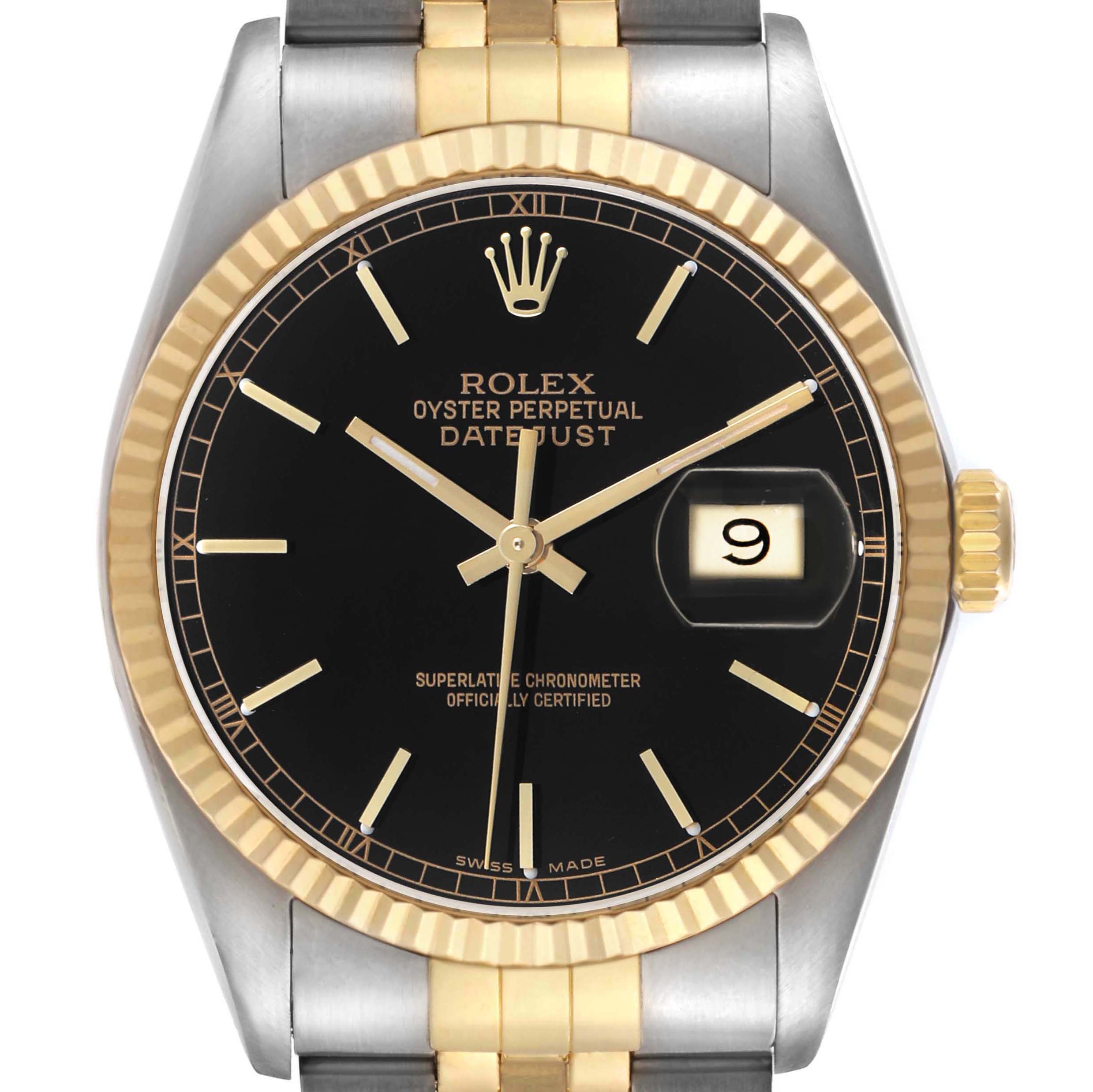 The Rolex Datejust 16013 Men's Steel and Gold (two tone) Black Dial watch is shown from a front angle, displaying its dial, bezel, and part of the bracelet.