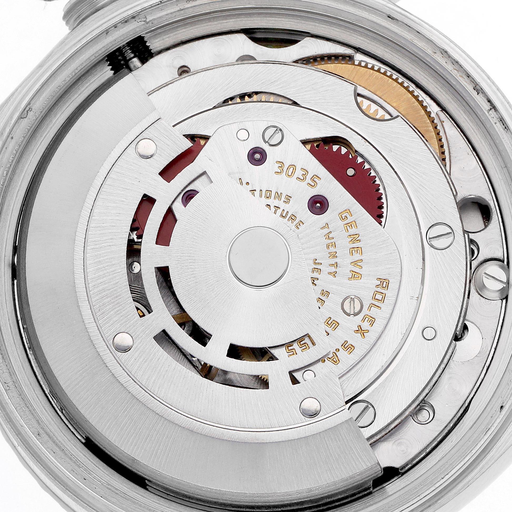 The image shows the exposed movement of a Rolex Datejust 16030 Men
s Stainless Steel Silver Dial 16030 Men
s Stainless Steel Silver Dial, viewed from the back, highlighting gears and inscriptions.