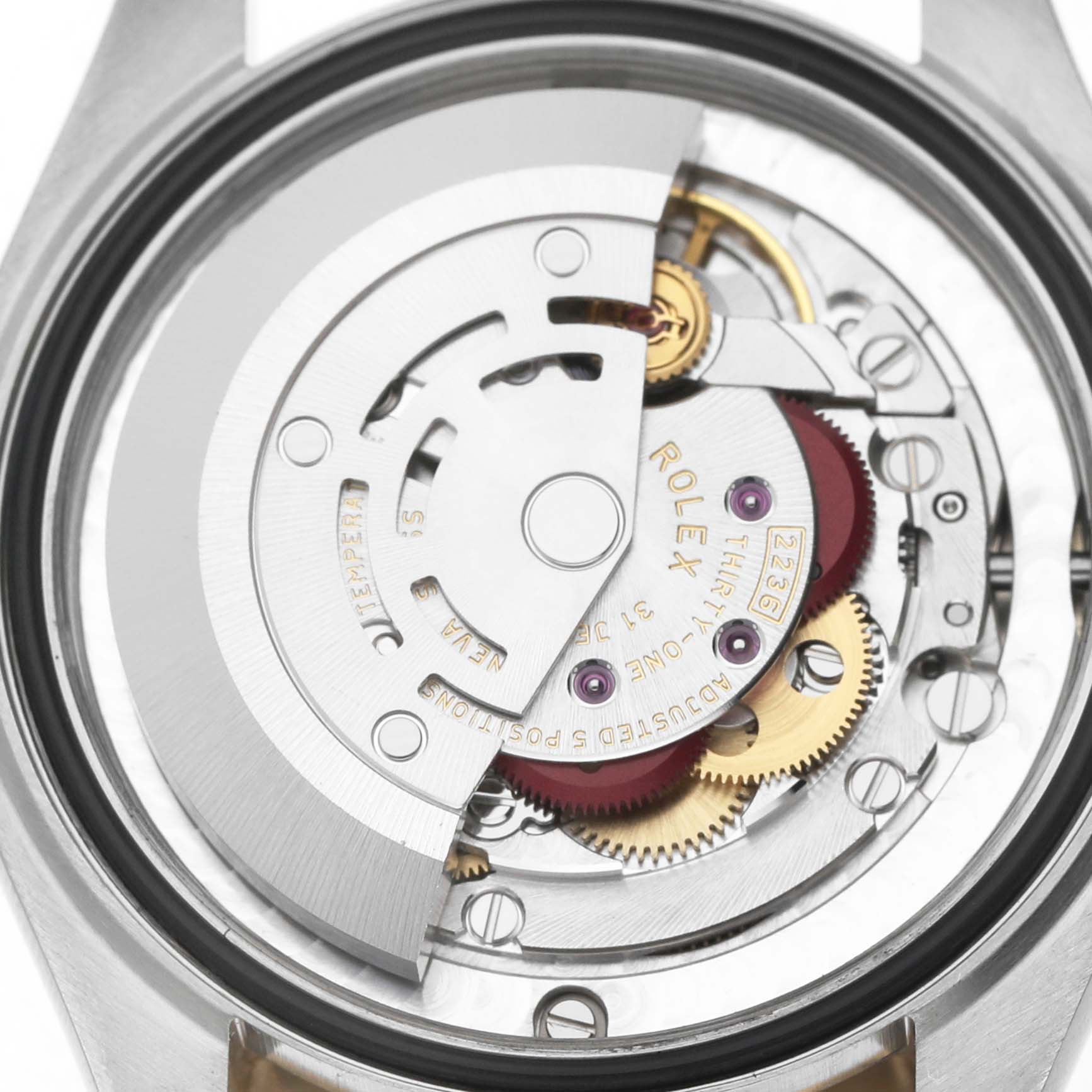 The image shows the internal mechanism of a Rolex Mid-Size 278273 Women's Steel and Gold (two tone) Champagne Dial watch focusing on the movement from a rear angle.
