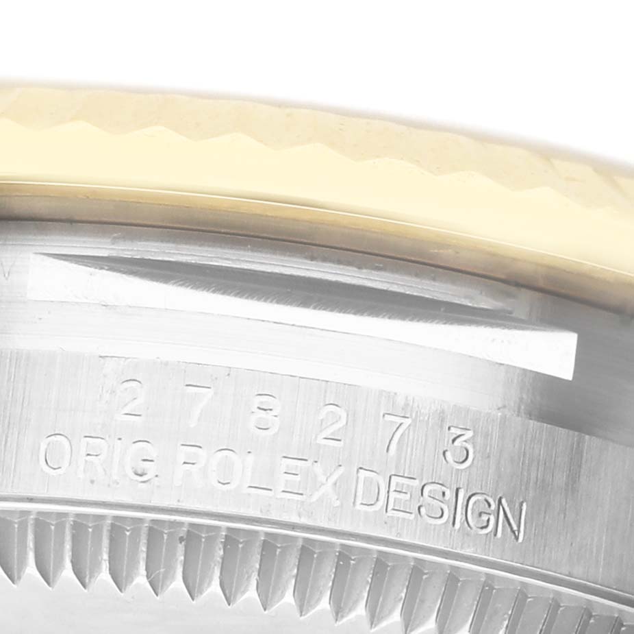 The image shows a close-up of the side of a Rolex Mid-Size 278273 Women's Steel and Gold (two tone) Champagne Dial watch, focusing on the engraved bezel and serial number.