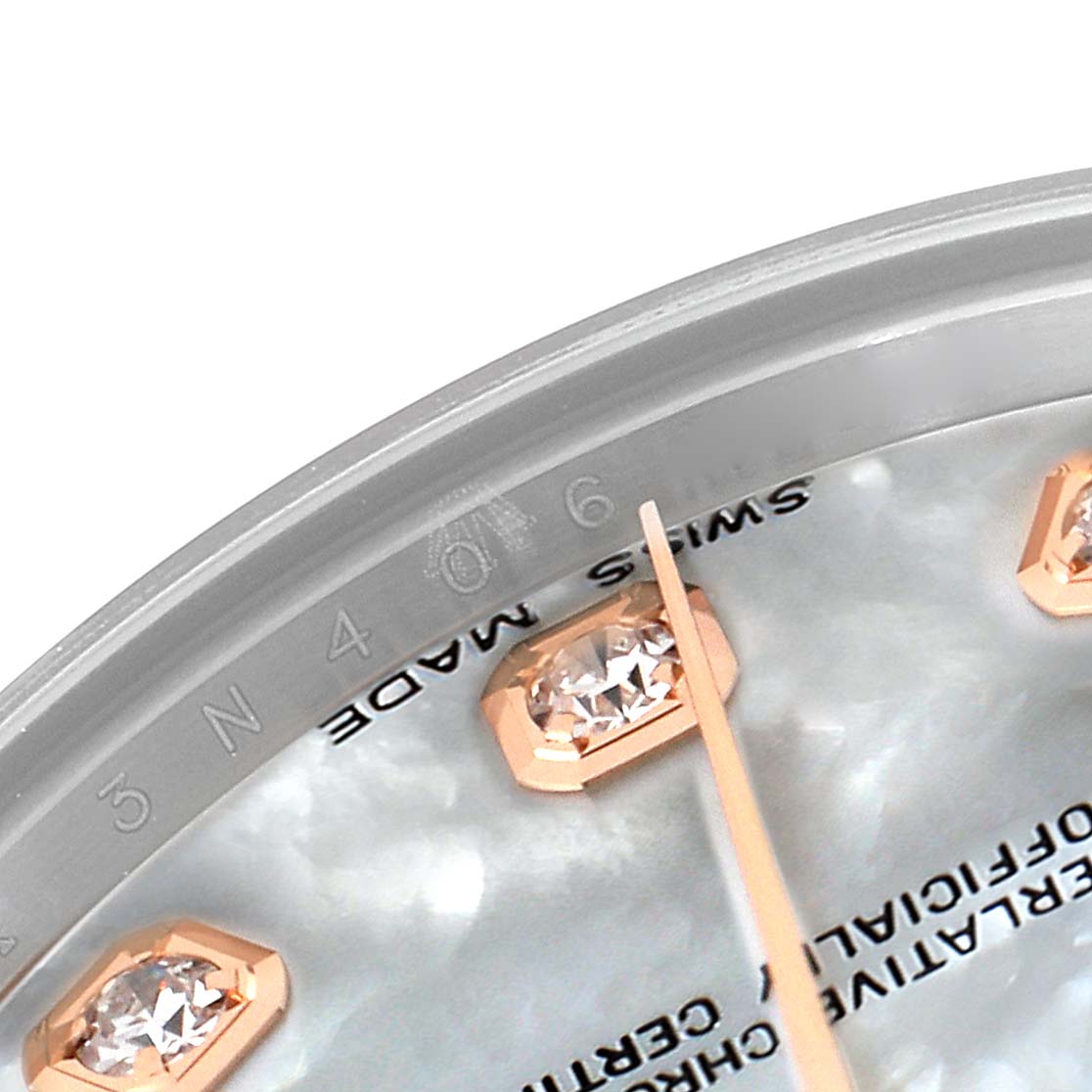 This image shows a close-up of the dial and diamond markers of a Rolex Mid-Size 178271 Women's Steel and Gold (two tone) Mother of Pearl Dial 178271 Women's Steel and Gold (two tone) Mother of Pearl Dial watch.