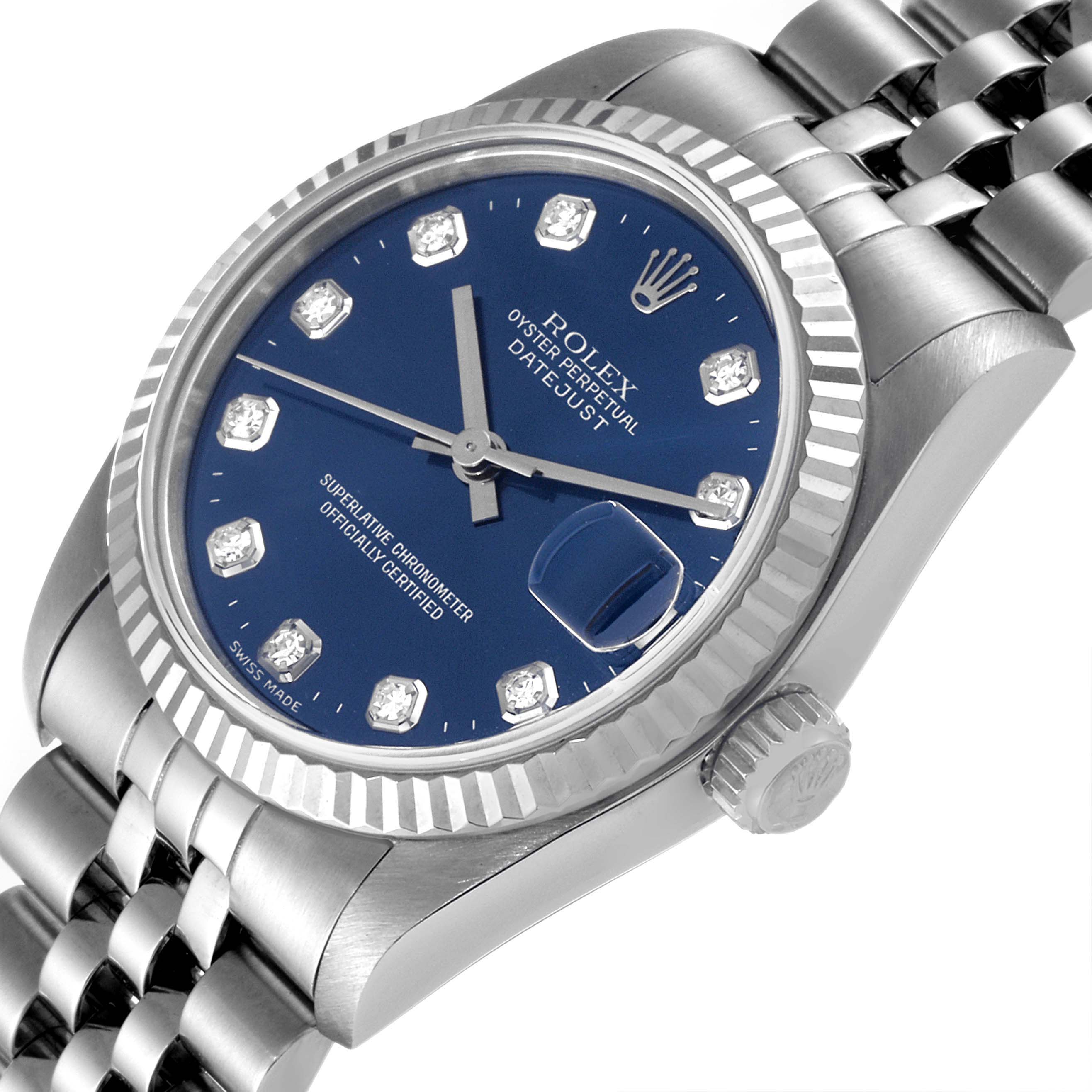 The image shows a Rolex Mid-Size 68274 Women's Stainless Steel Blue Dial 68274 Women's Stainless Steel Blue Dial Datejust watch from an angled close-up, highlighting its blue dial, bezel, crown, and part of the bracelet.