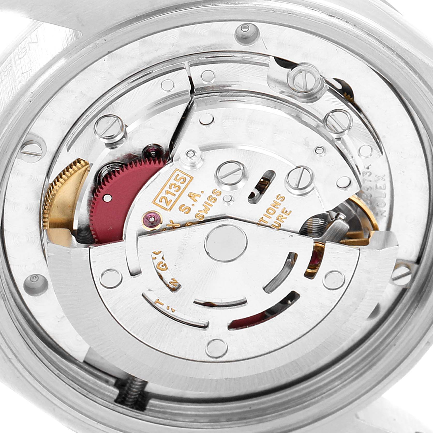 This image shows a close-up view of the movement mechanism of a Rolex Mid-Size 68274 Women's Stainless Steel Blue Dial 68274 Women's Stainless Steel Blue Dial watch, showcasing the intricate parts and inner workings.