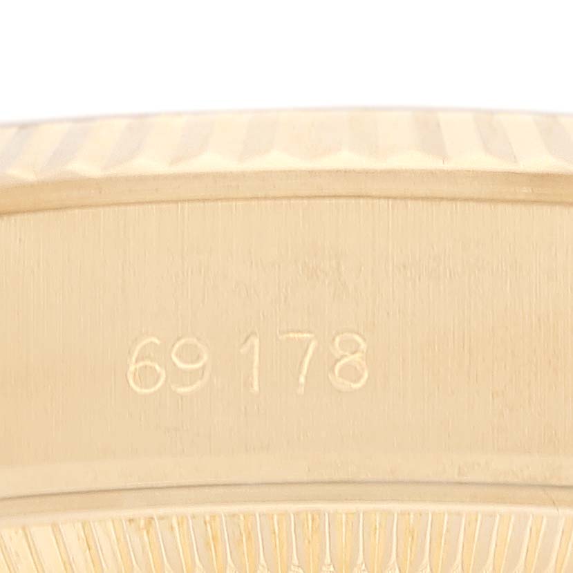 This image shows the side of the case and part of the fluted bezel of a Rolex President 69178 Women
s Yellow Gold Champagne Dial 69178 Women
s Yellow Gold Champagne Dial model, displaying the model number 69178.