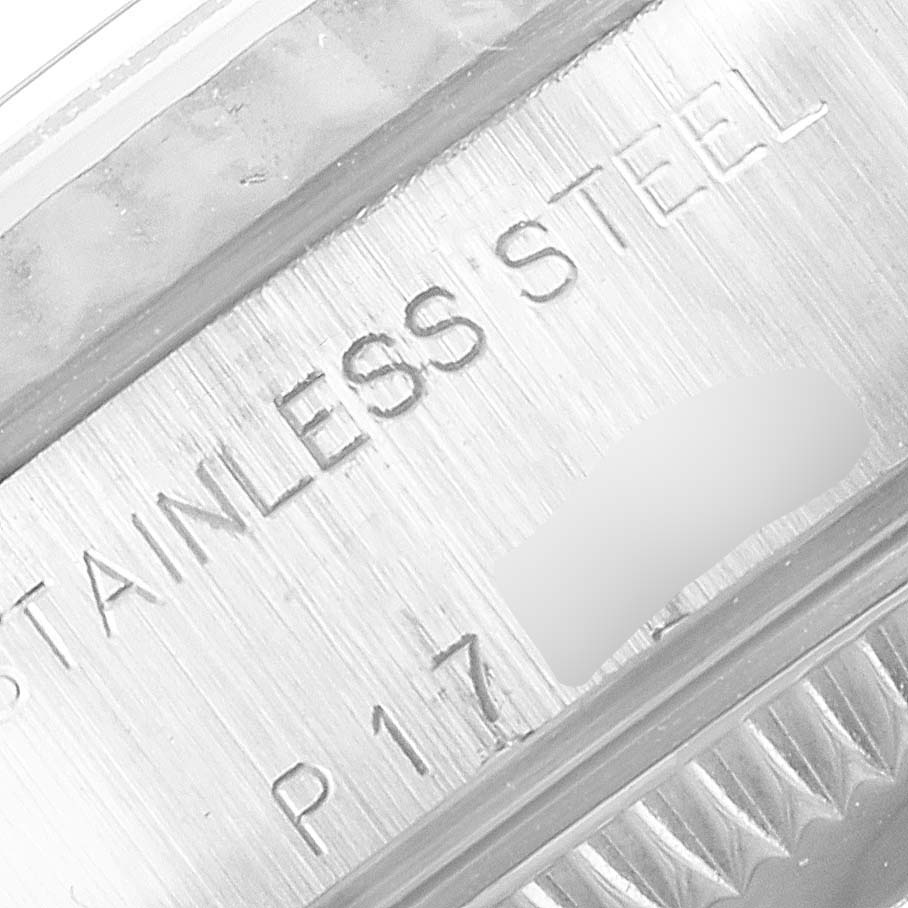 The image shows a close-up angle of the engraving on the stainless steel casing of a Rolex Datejust 79174 Women's Stainless Steel Black Dial 79174 Women's Stainless Steel Black Dial watch.