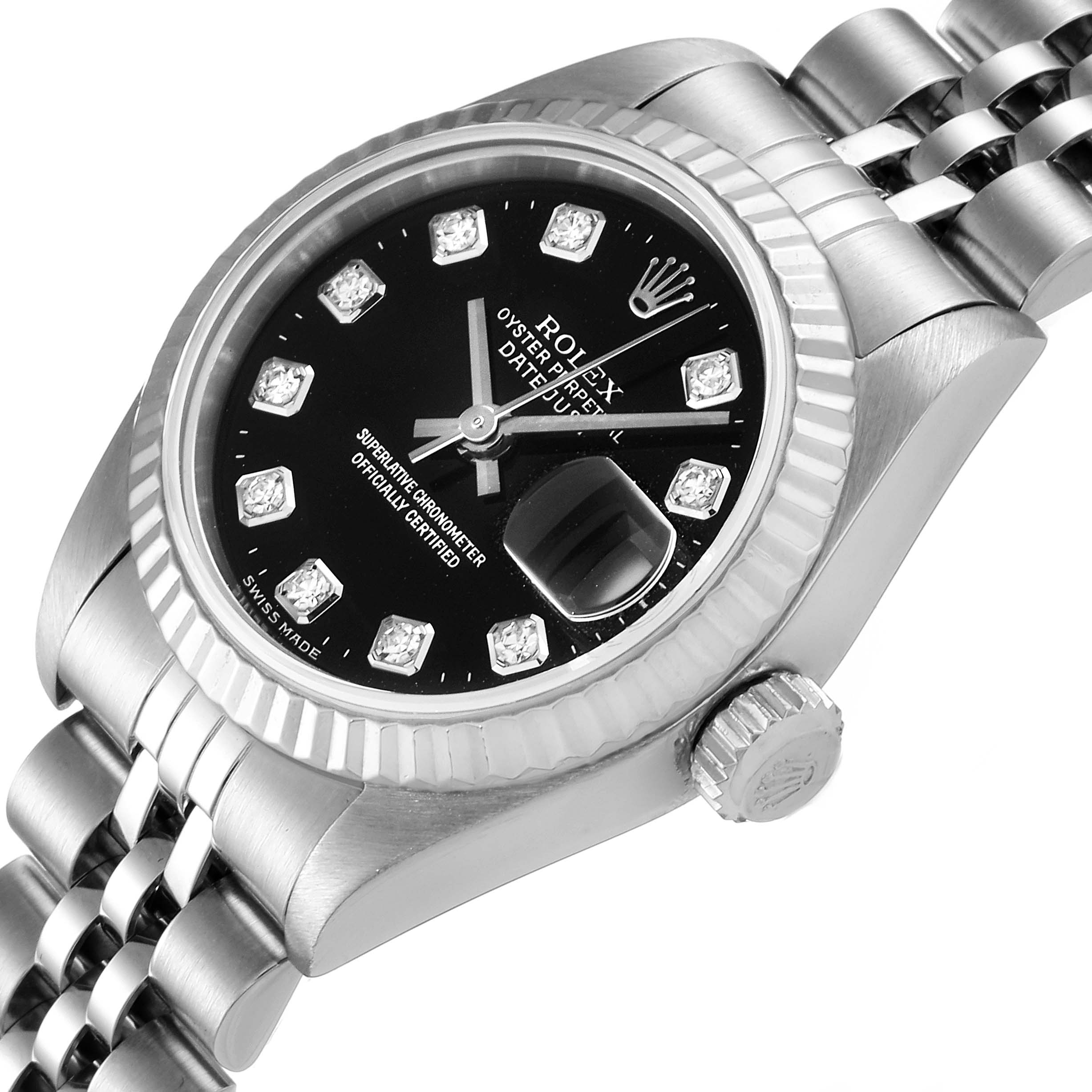 The image shows a close-up of the Rolex Datejust 79174 Women's Stainless Steel Black Dial 79174 Women's Stainless Steel Black Dial's watch face, crown, and part of the bracelet.