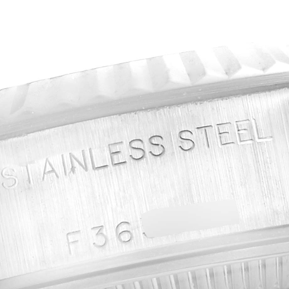 The image shows a close-up angle of the back casing of a Rolex Datejust 79174 Women's Stainless Steel Silver Dial 79174 Women's Stainless Steel Silver Dial watch, highlighting the "STAINLESS STEEL" engraving.