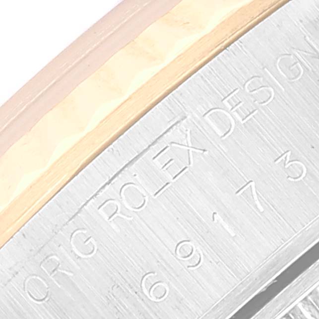 The image shows a close-up of the side engraving on a Rolex Datejust 69173 Women's Steel and Gold (two tone) Blue Dial 69173 Women's Steel and Gold (two tone) Blue Dial watch.