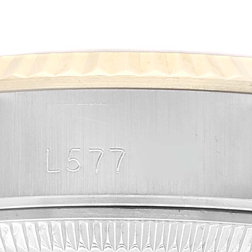 This image shows a close-up of the case side and part of the bezel of a Rolex Datejust 69173 Women's Steel and Gold (two tone) Champagne Dial 69173 Women's Steel and Gold (two tone) Champagne Dial watch.