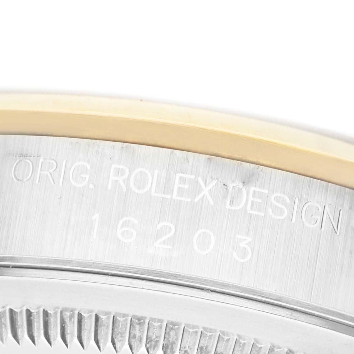 The image shows a close-up of the side of a Rolex Datejust 16203 Men's Steel and Gold (two tone) Silver Dial watch, focusing on the engraved model number with part of the bezel visible.