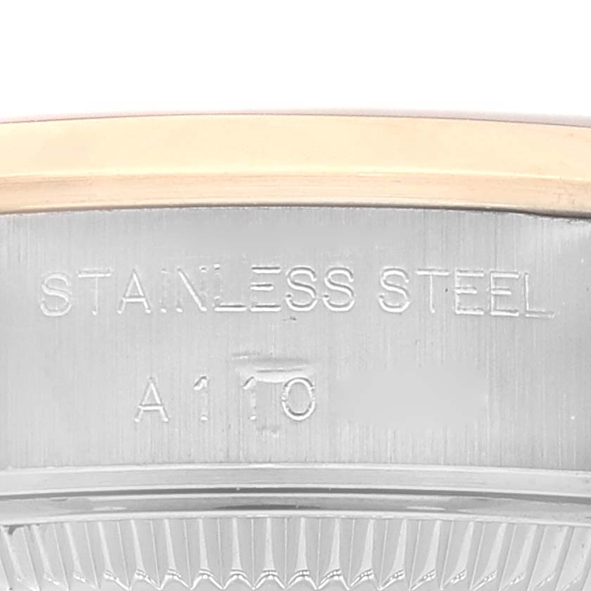 Close-up view of the casing of the Rolex Datejust 79163 Women's Steel and Gold (two tone) White Dial 79163 Women's Steel and Gold (two tone) White Dial, showing stainless steel and part of the model engravings.