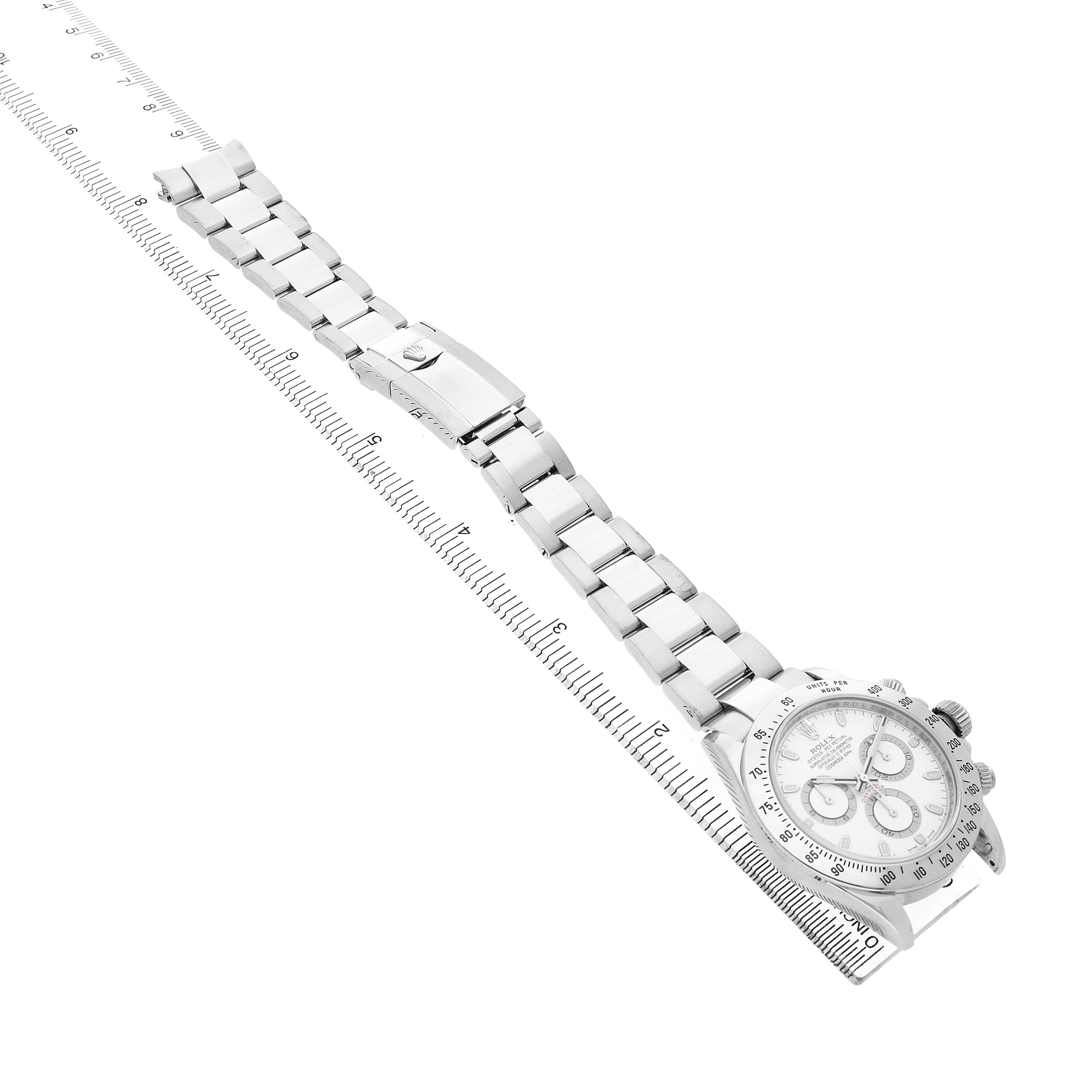 The Rolex Daytona 116520 Men's Stainless Steel White Dial watch is shown from a diagonal angle, highlighting the bracelet, clasp, and part of the bezel.