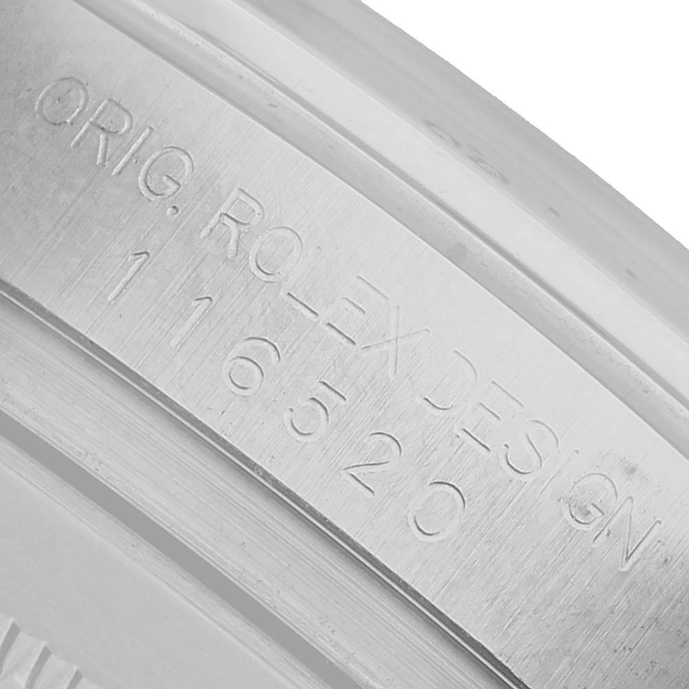 The image shows the inner bezel or case engraving of a Rolex Daytona 116520 Men's Stainless Steel White Dial, displaying the model number.