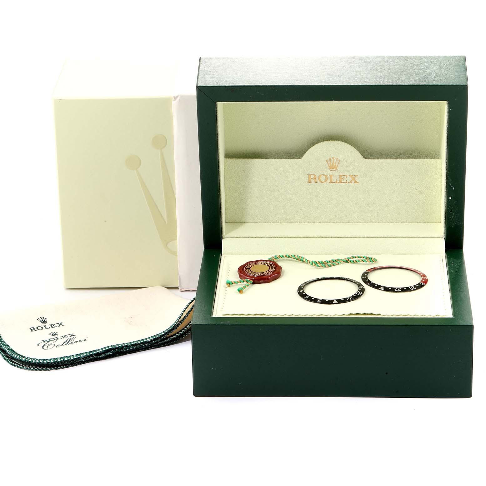 The image shows a Rolex GMT-Master 16710 Men's Stainless Steel Black Dial 16710 Men's Stainless Steel Black Dial presentation box containing bezels, a hang tag, a cloth, and outer packaging.