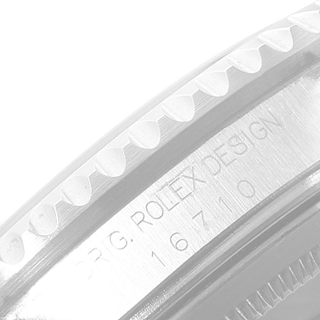 This image shows a close-up side view of the bezel and engraved model number "16710" on a Rolex GMT-Master 16710 Men's Stainless Steel Black Dial 16710 Men's Stainless Steel Black Dial watch.