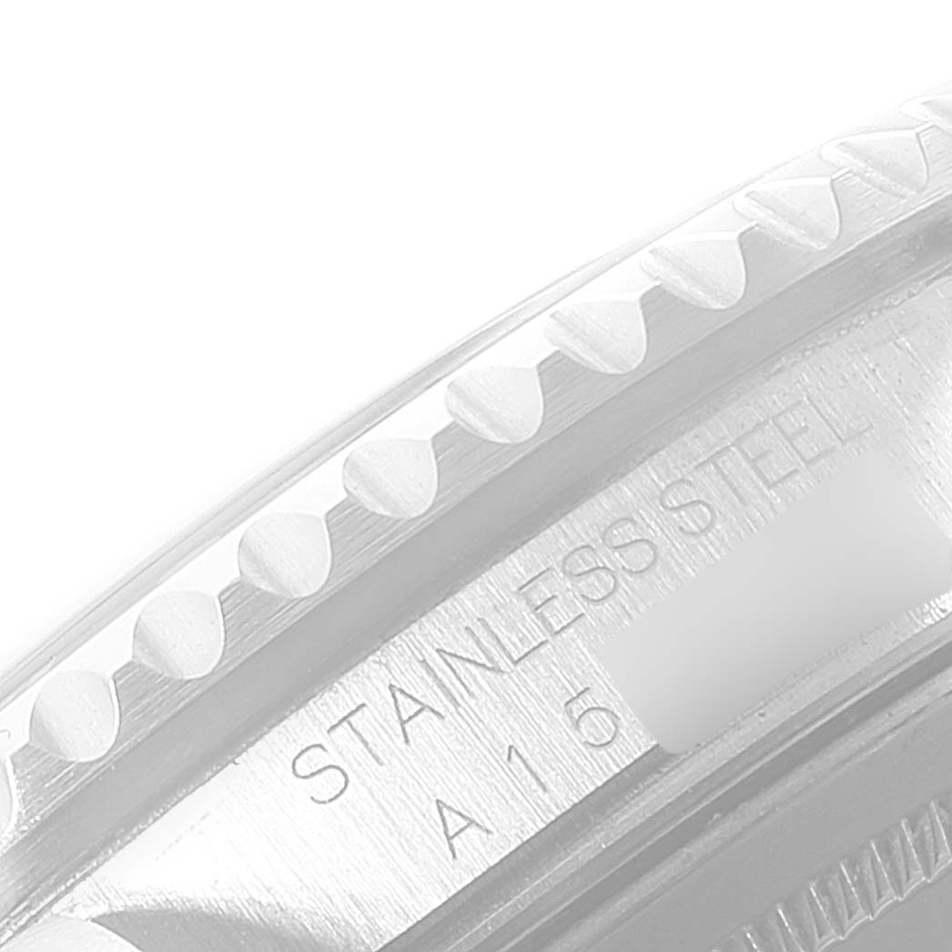 The image shows a close-up of the Rolex GMT-Master 16710 Men's Stainless Steel Black Dial 16710 Men's Stainless Steel Black Dial's stainless steel bezel and part of the case.
