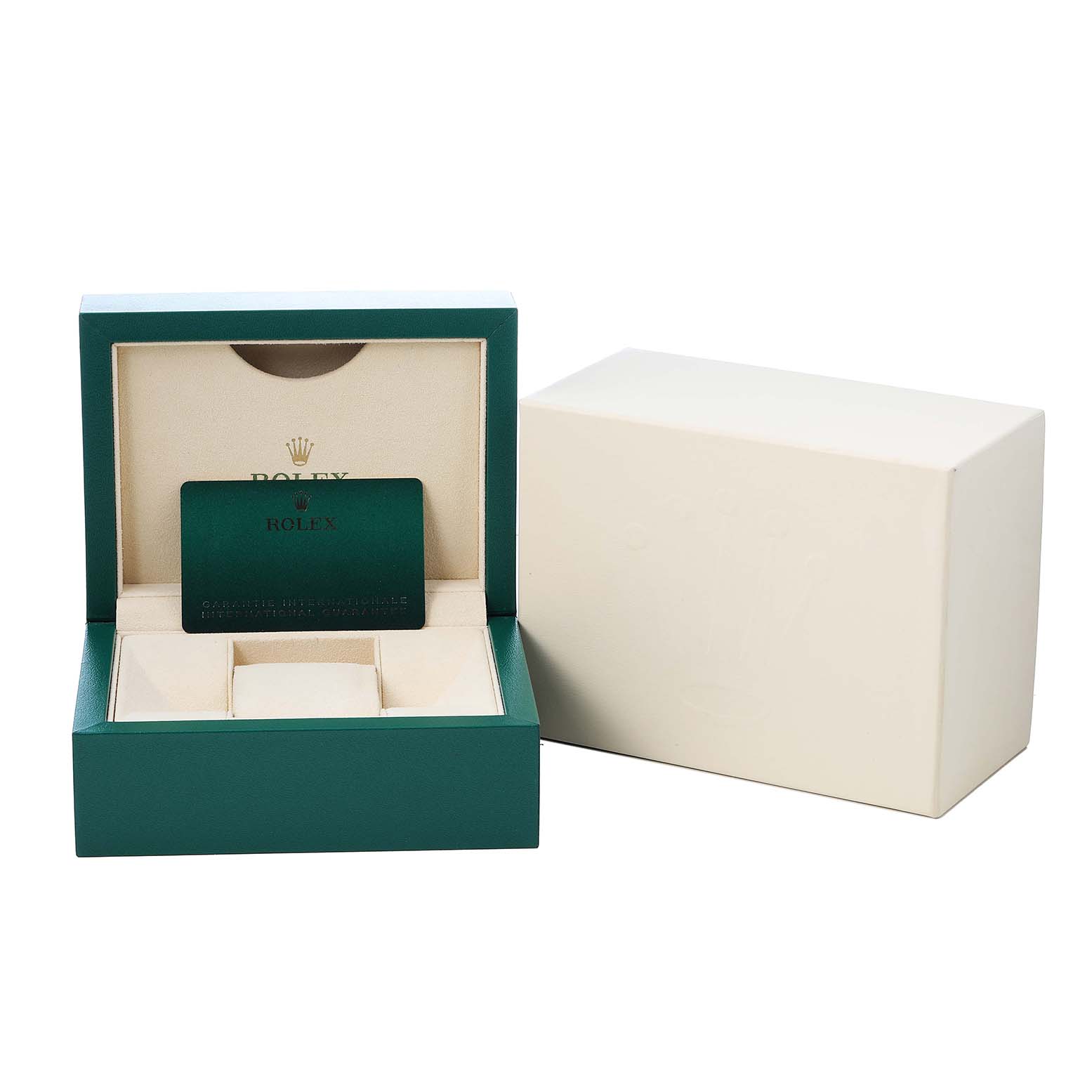 The image shows a Rolex Land-Dweller watch box set at an angle with an open lid, revealing a card inside.