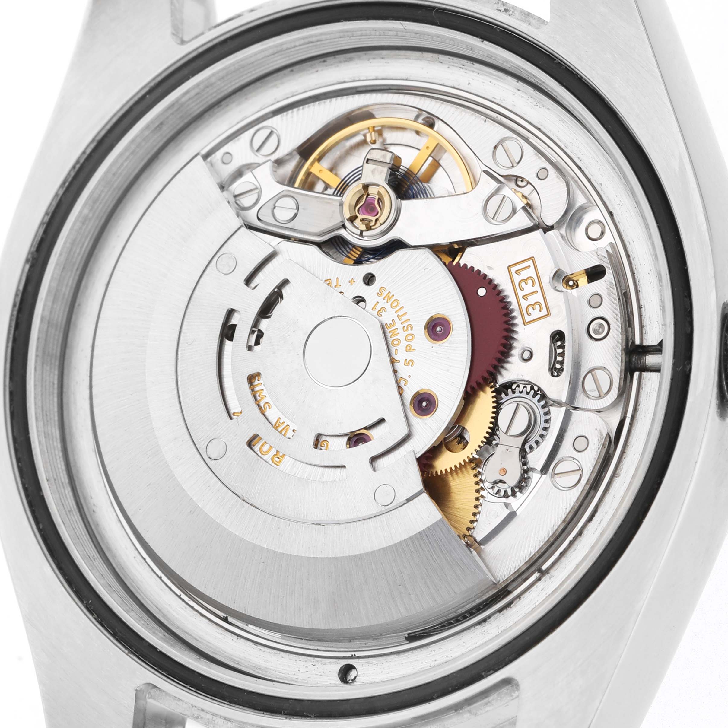 The image shows the backside of a Rolex Milgauss 116400GV Men's Stainless Steel Black Dial, highlighting its intricate mechanical movement.