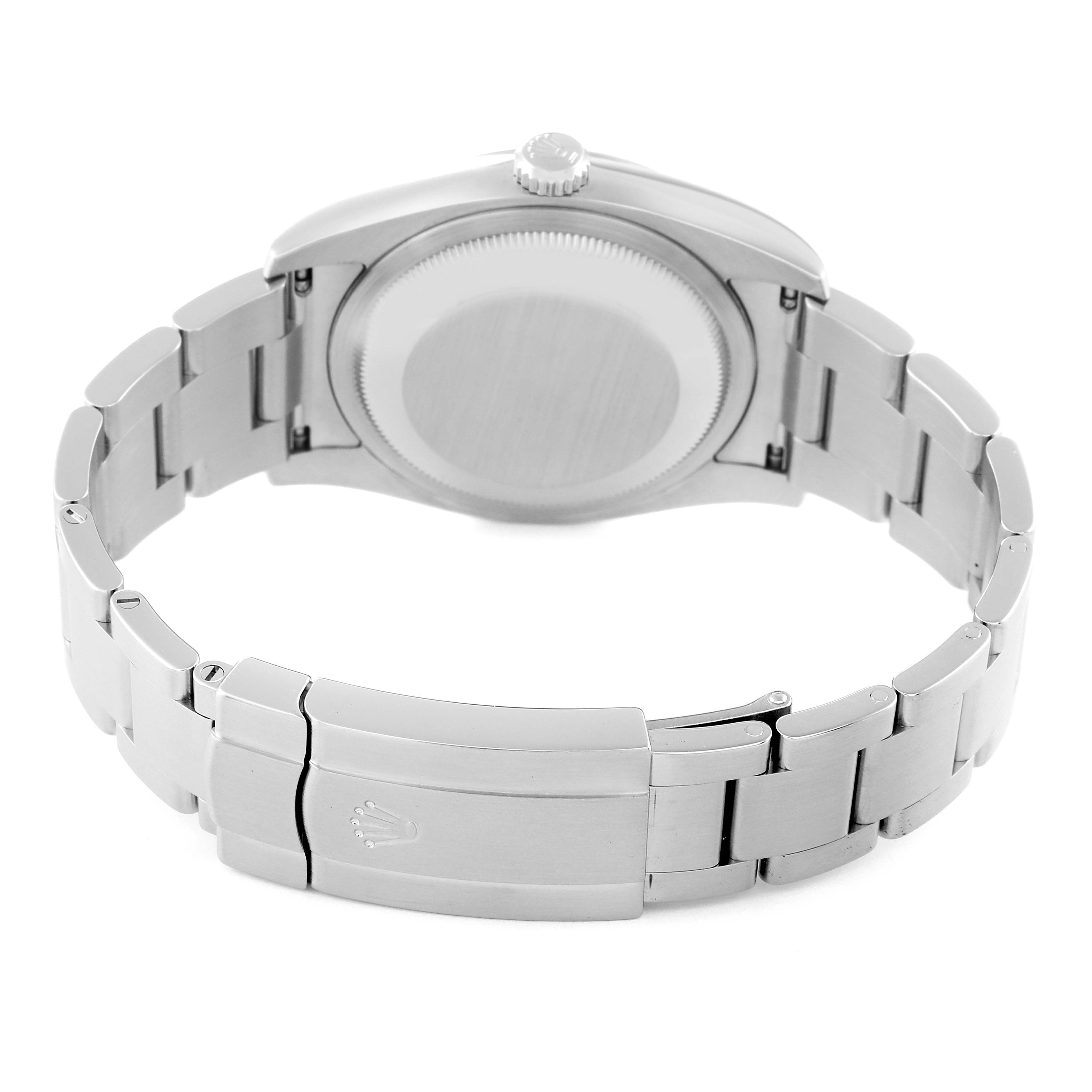 The image shows the back case and bracelet clasp of a Rolex Oyster Perpetual 116000 Men's Stainless Steel Black Dial 116000 Men's Stainless Steel Black Dial watch at a rear angle.