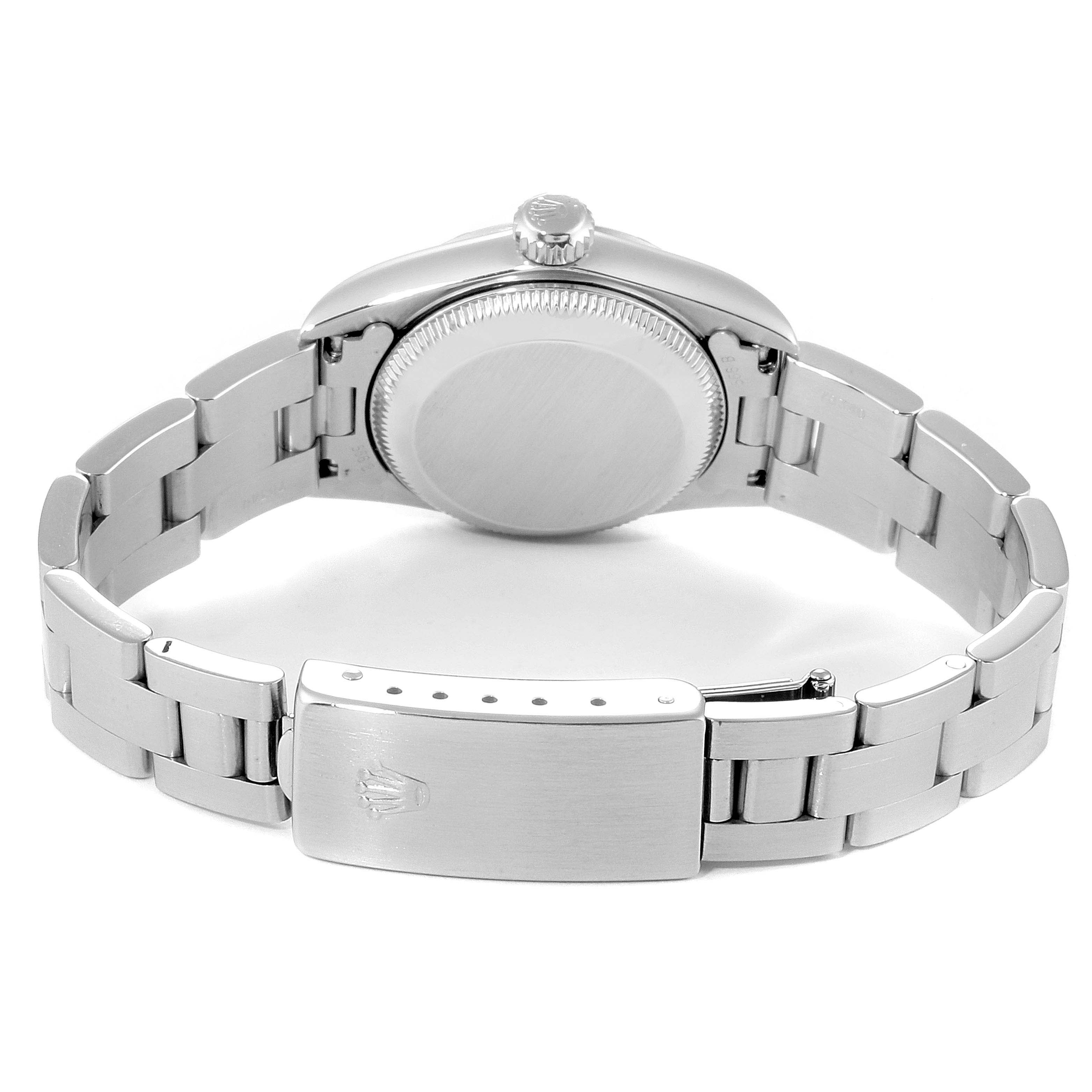 The image shows the back view of a Rolex Oyster Perpetual 67230 Women
s Stainless Steel Blue Dial 67230 Women
s Stainless Steel Blue Dial, displaying the case back and bracelet clasp.