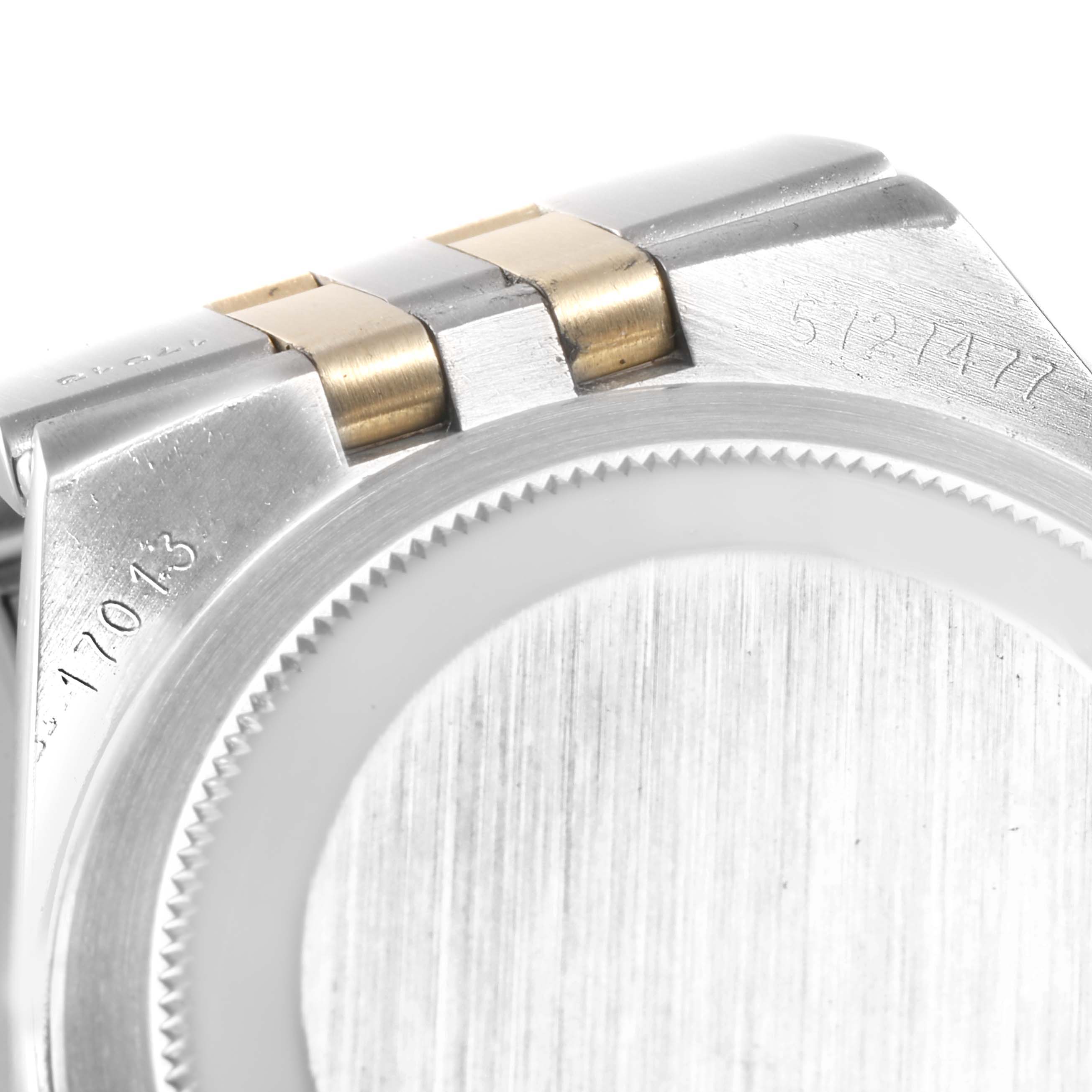 This close-up of the Rolex Oysterquartz 17013 Men's Steel and Gold (two tone) Silver Dial 17013 Men's Steel and Gold (two tone) Silver Dial watch showcases the case back and part of the bracelet with visible serial numbers.