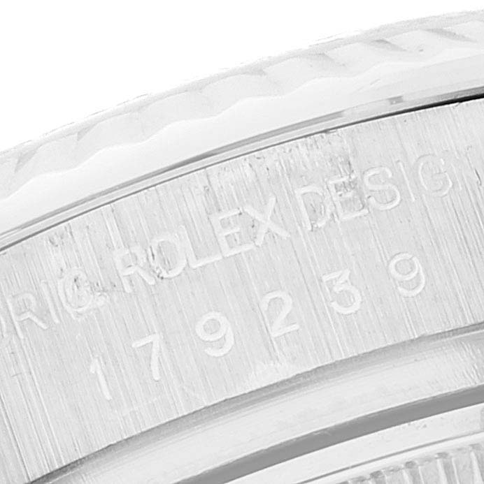 This close-up image shows the side engraving on the bezel of a Rolex President 179239 Women's White Gold Mother of Pearl Dial 179239 Women's White Gold Mother of Pearl Dial model watch.